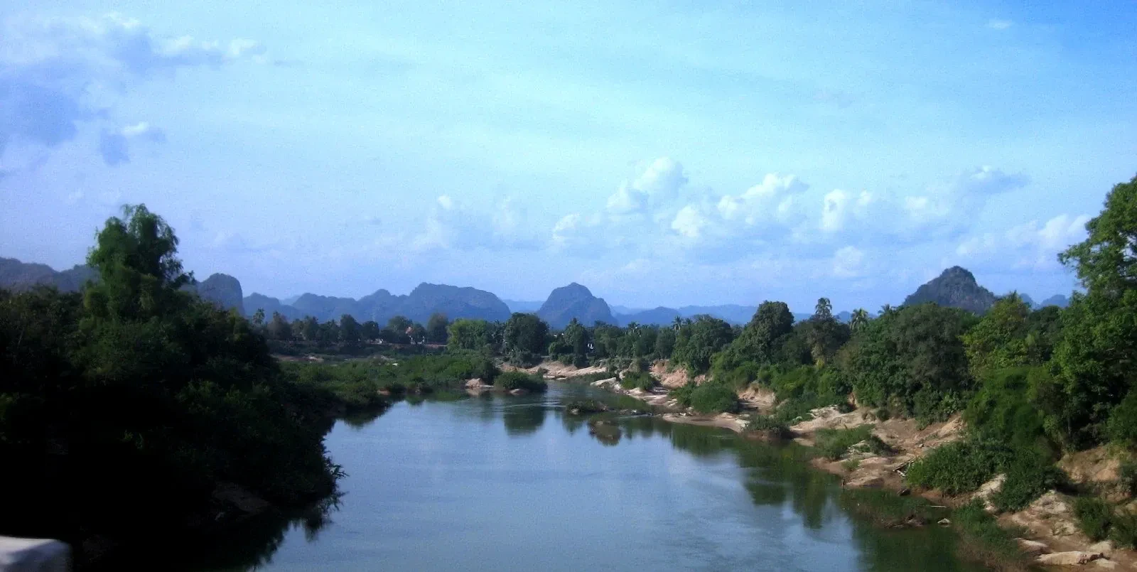 A river below limestone hills in Khammouane province