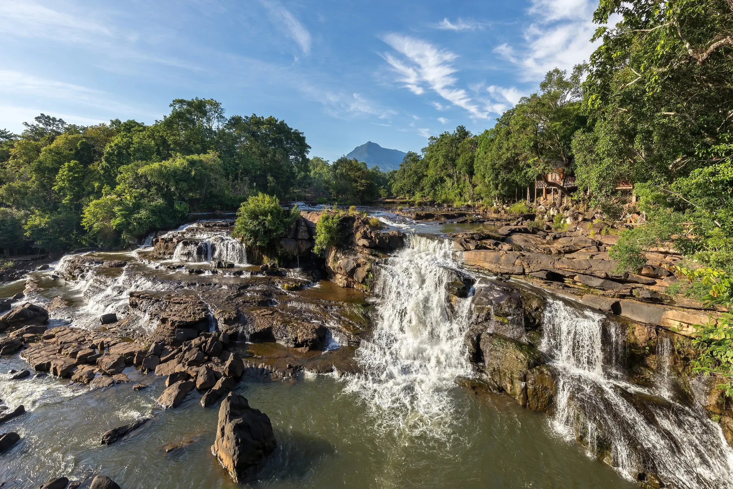 A waterfall tumbling over rocks at Tad Lo on the Bolaven Plateau