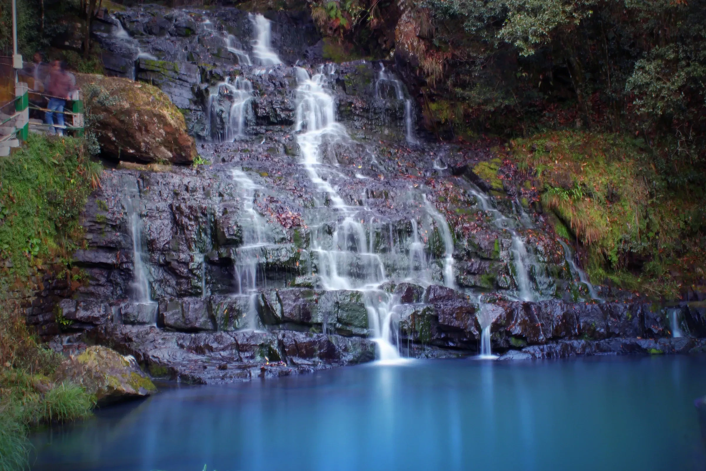 The tiered Elephant Falls spilling over dark rock into a pool near Shillong