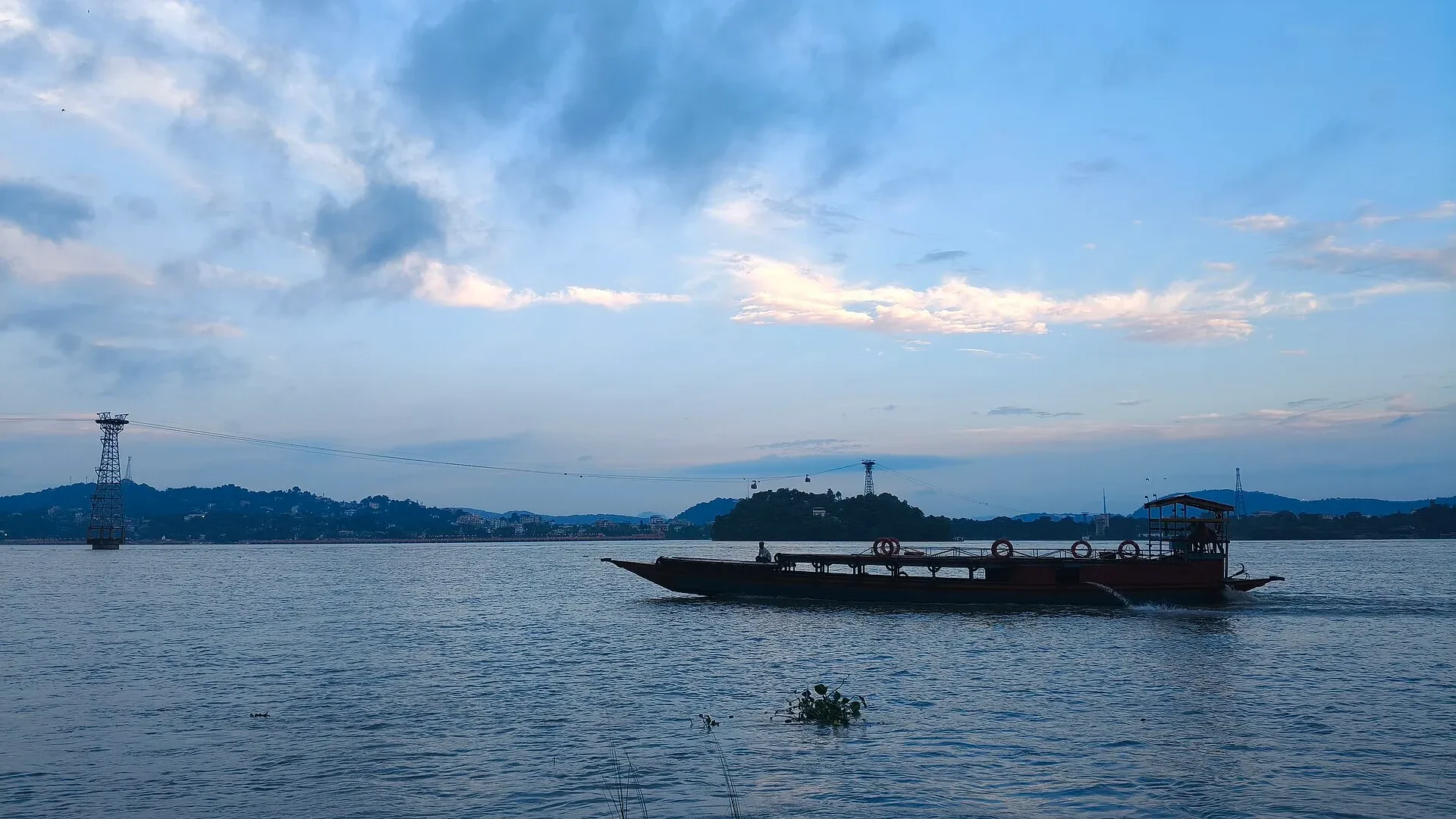 A boat on the Brahmaputra River near Umananda Temple in Guwahati