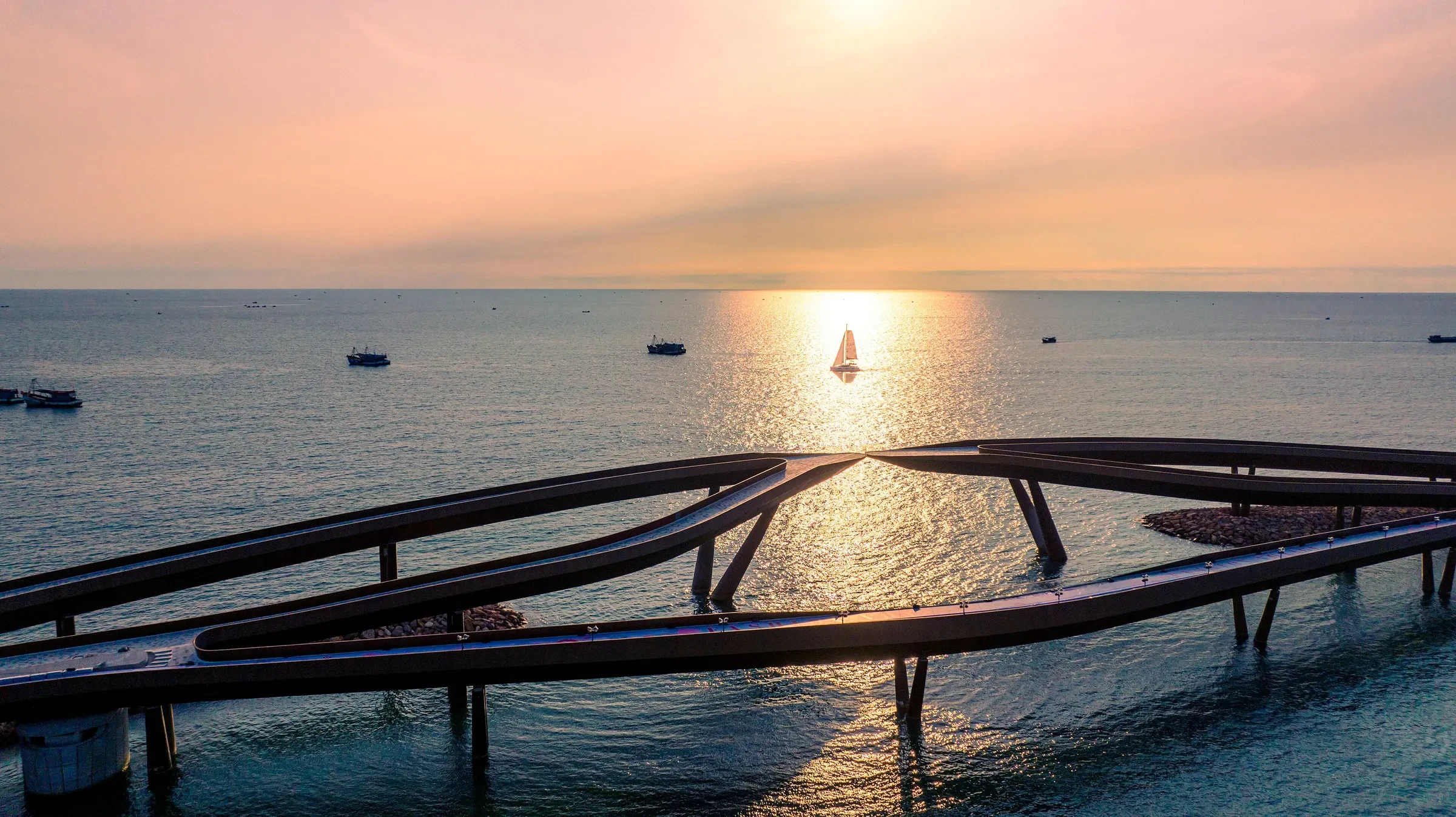The Kiss Bridge walkway at sunset in Sunset Town, Phu Quoc