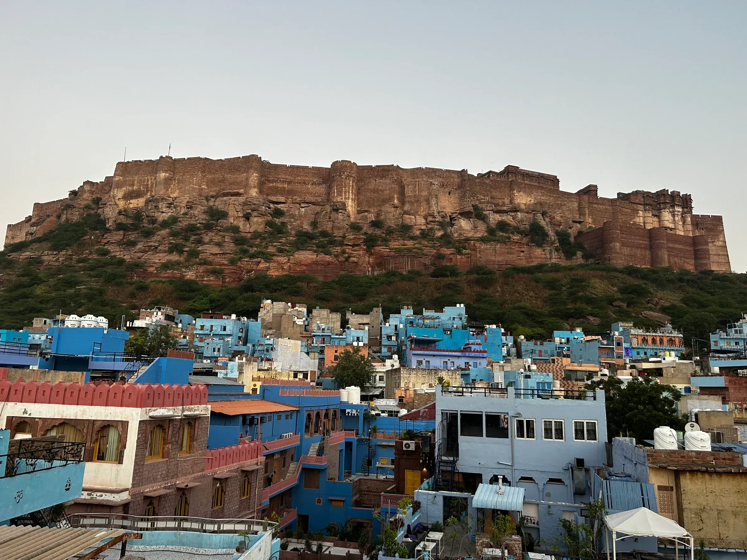 Mehrangarh Fort above the blue-painted houses of Jodhpur at dawn