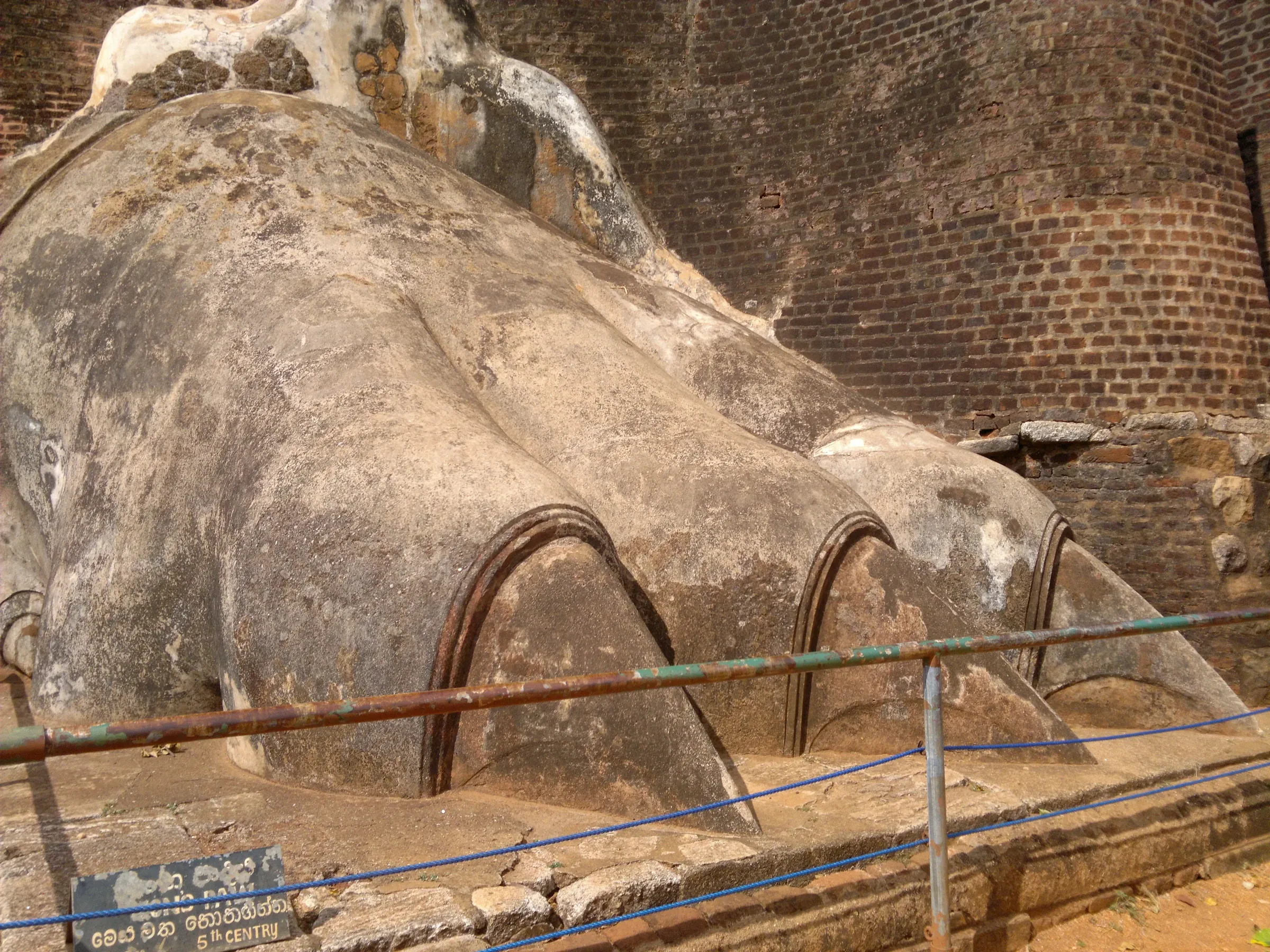 One of the two carved lion paws on the Lion's Paw terrace at Sigiriya, behind a rope barrier