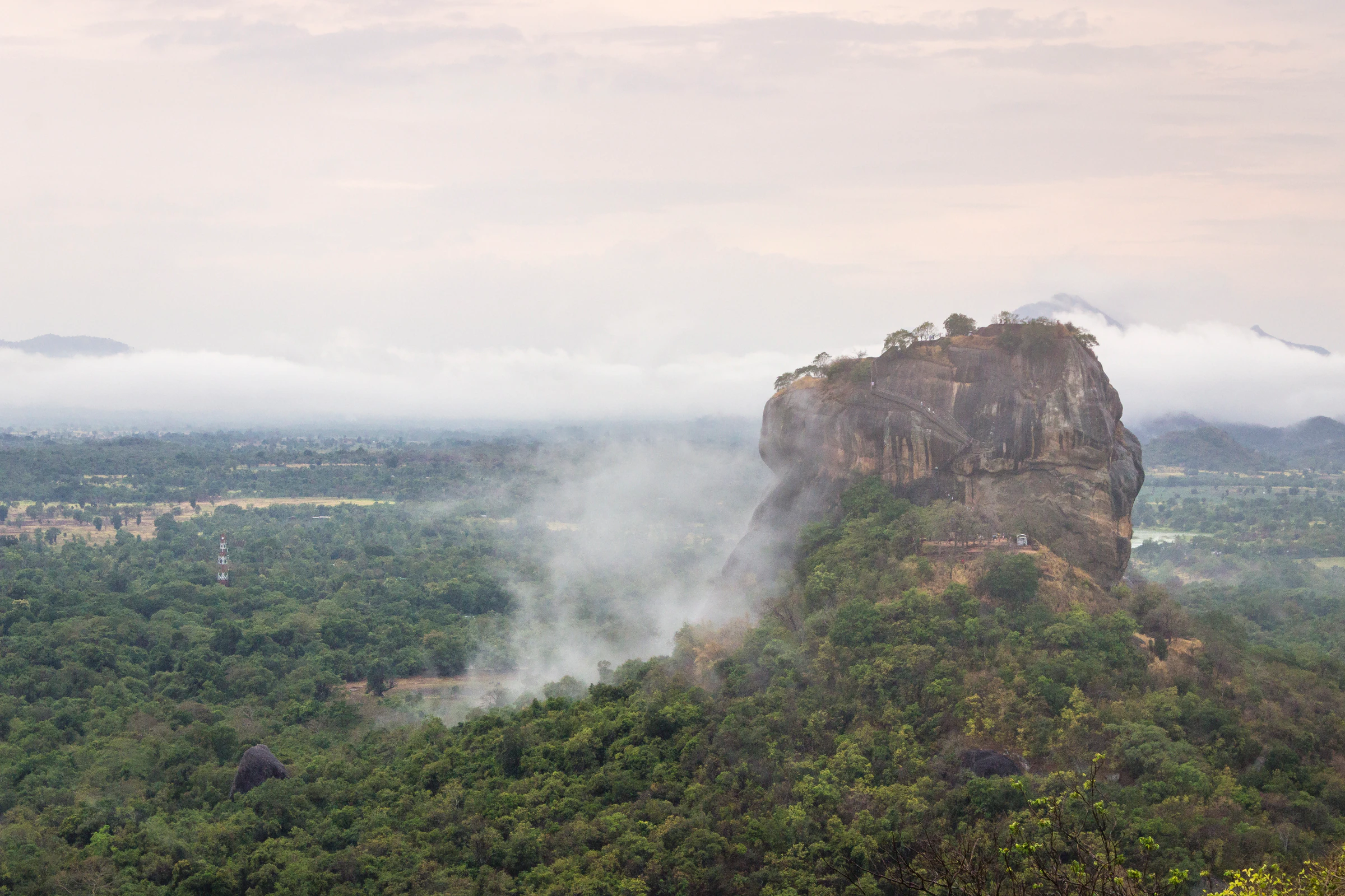 Sigiriya rock fortress rising above the jungle canopy in Sri Lanka's Cultural Triangle