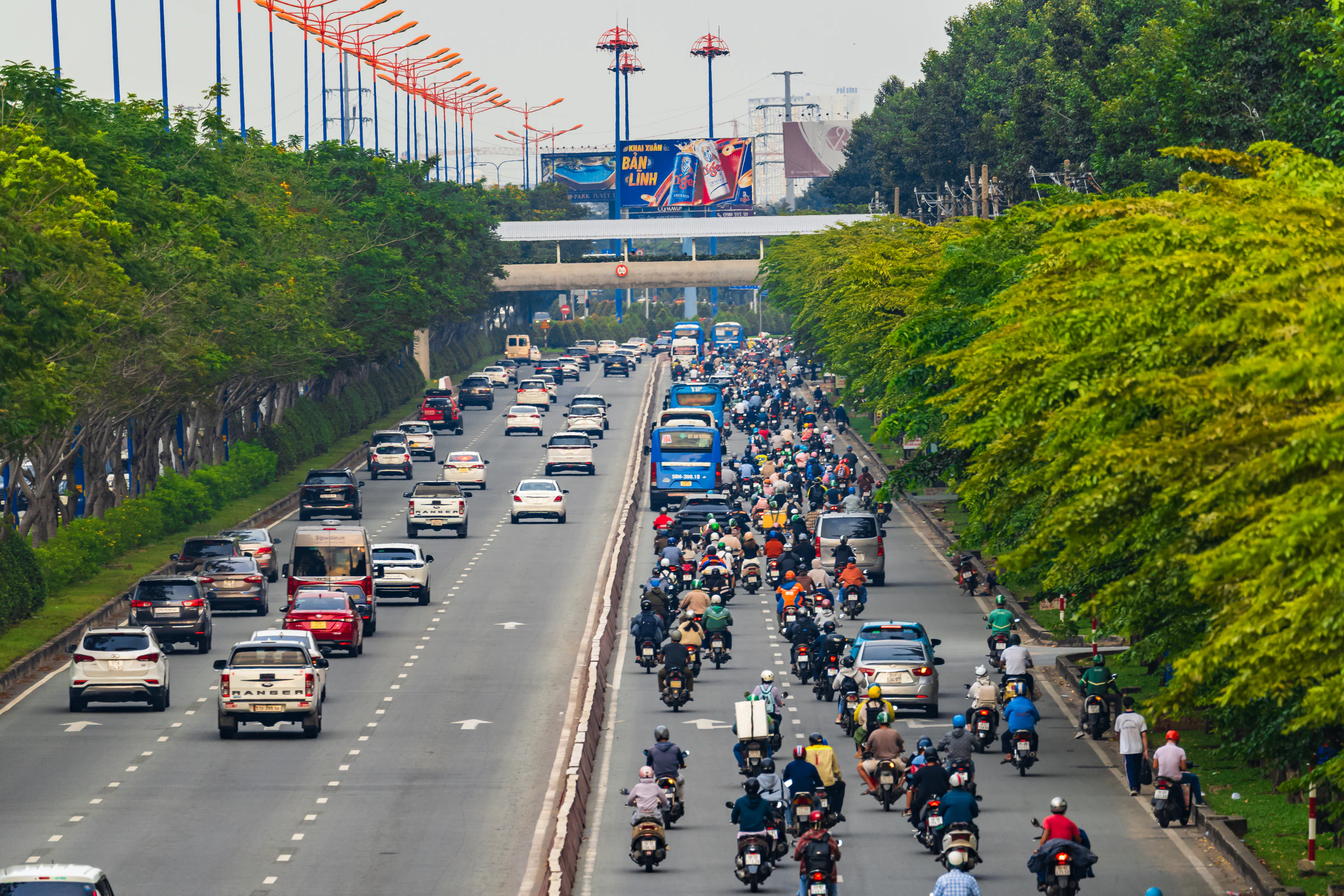 Heavy motorbike traffic on a Saigon street at rush hour
