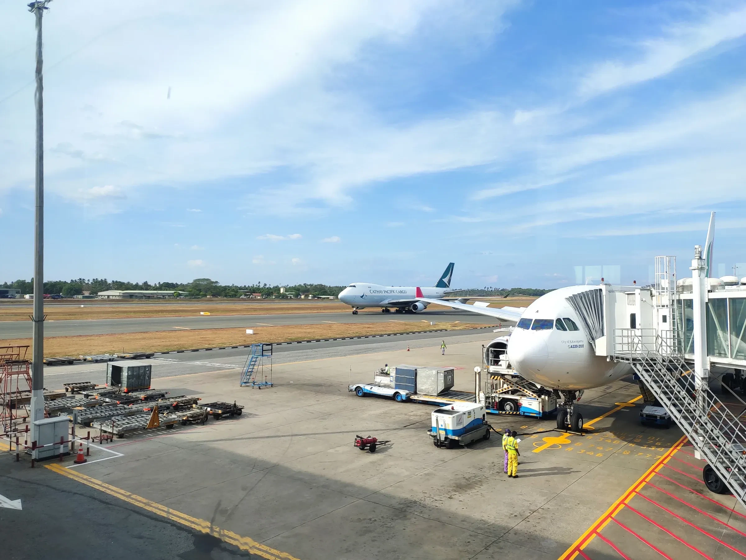 An aircraft at a boarding bridge at Bandaranaike International Airport