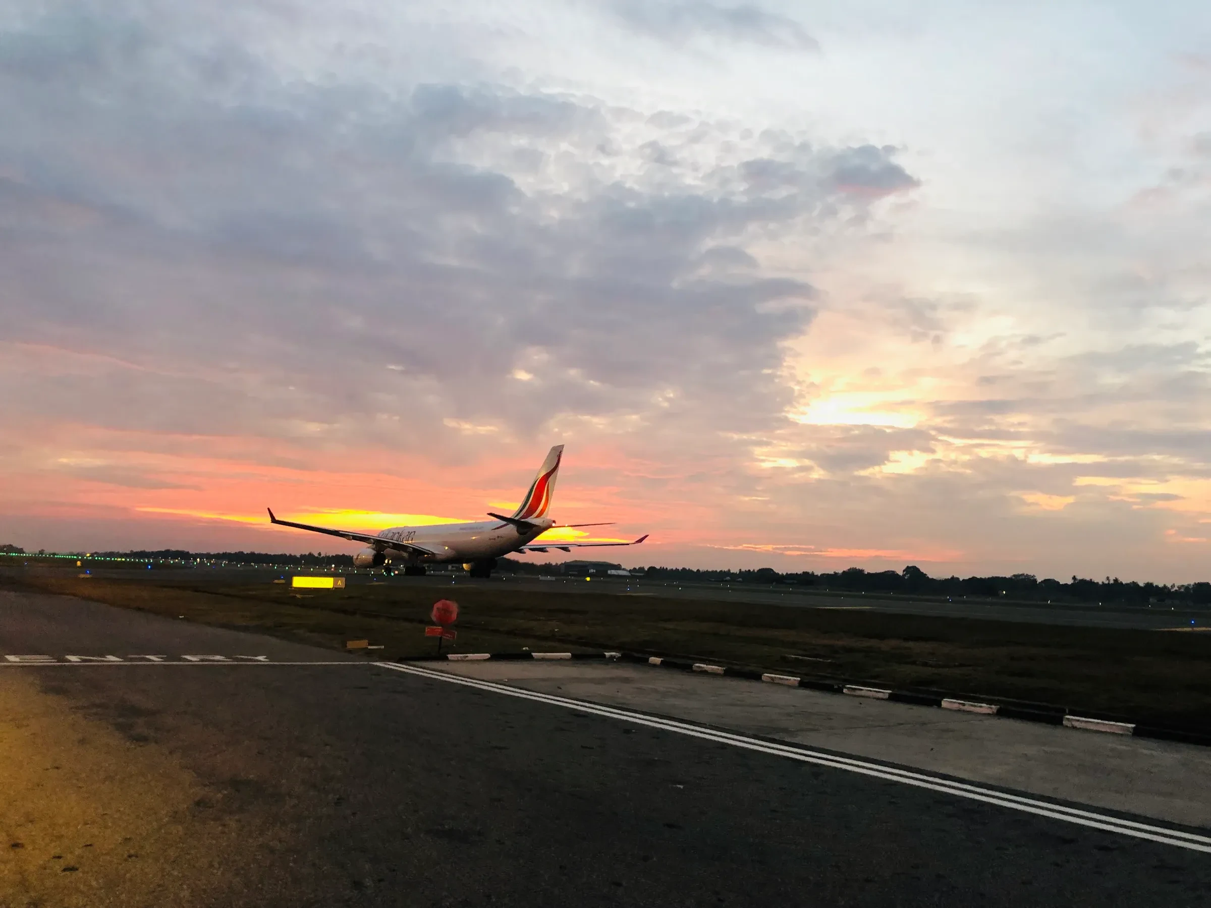 A SriLankan Airlines Airbus A330 on the ground at Colombo airport at sunset