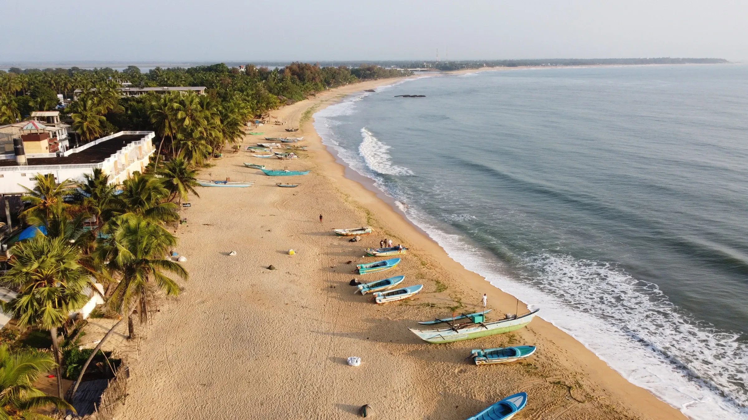 Boats pulled up on the beach at Arugam Bay on Sri Lanka's east coast