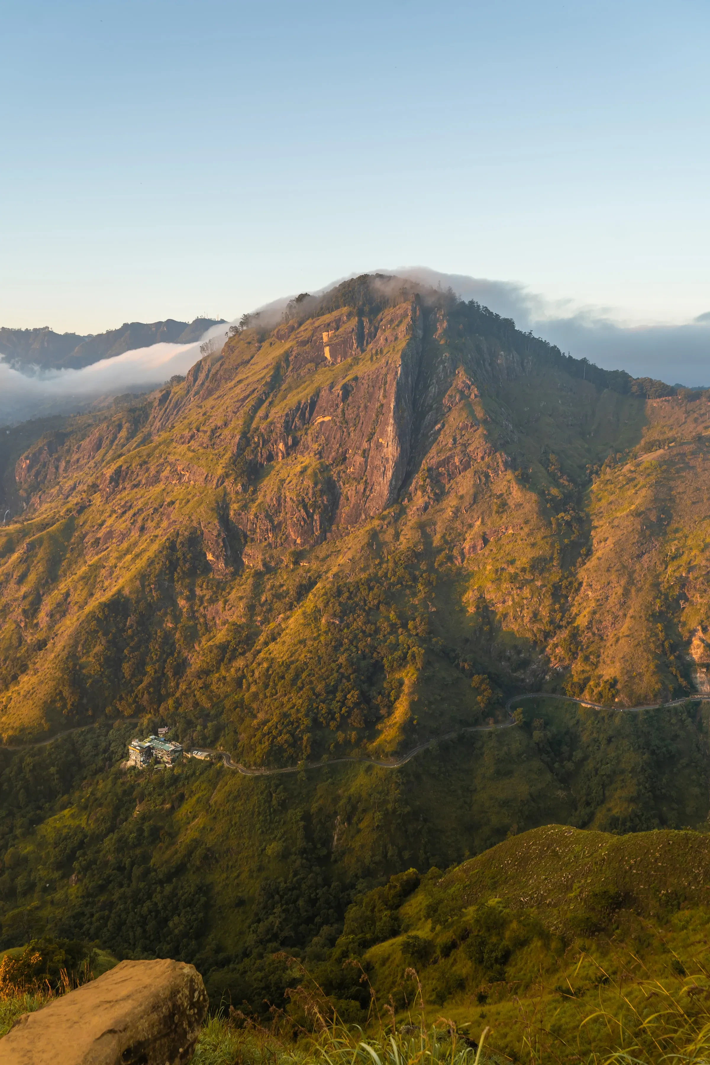 Green hills near Ella in Sri Lanka's hill country, lit by early morning sun