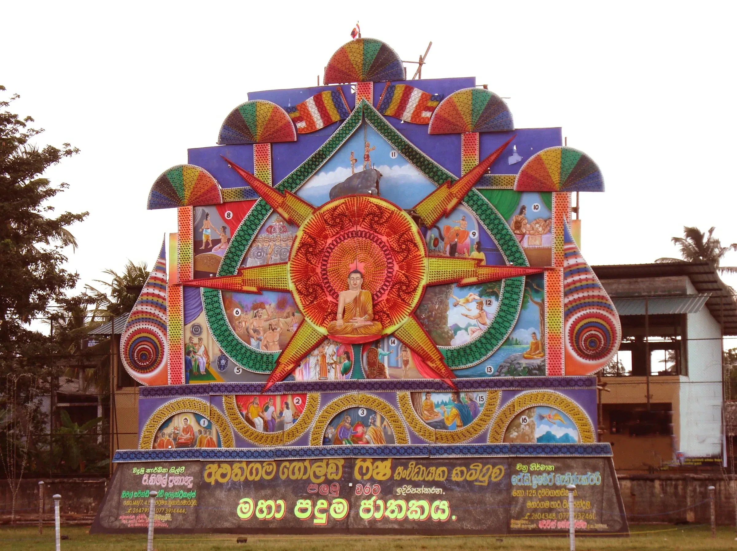 A brightly painted Poson pandal lit for the festival at Aluthgama, Sri Lanka