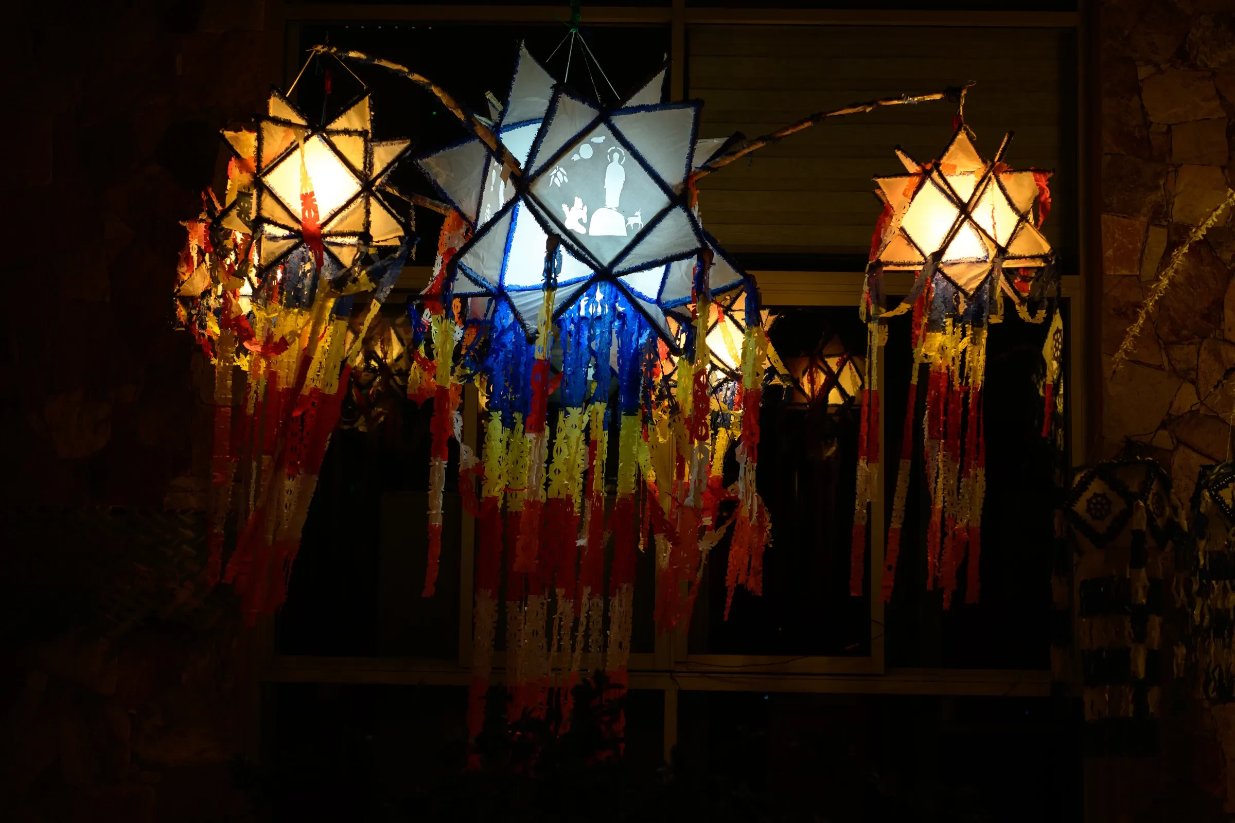 Colourful paper lanterns glowing at night during Vesak in Sri Lanka