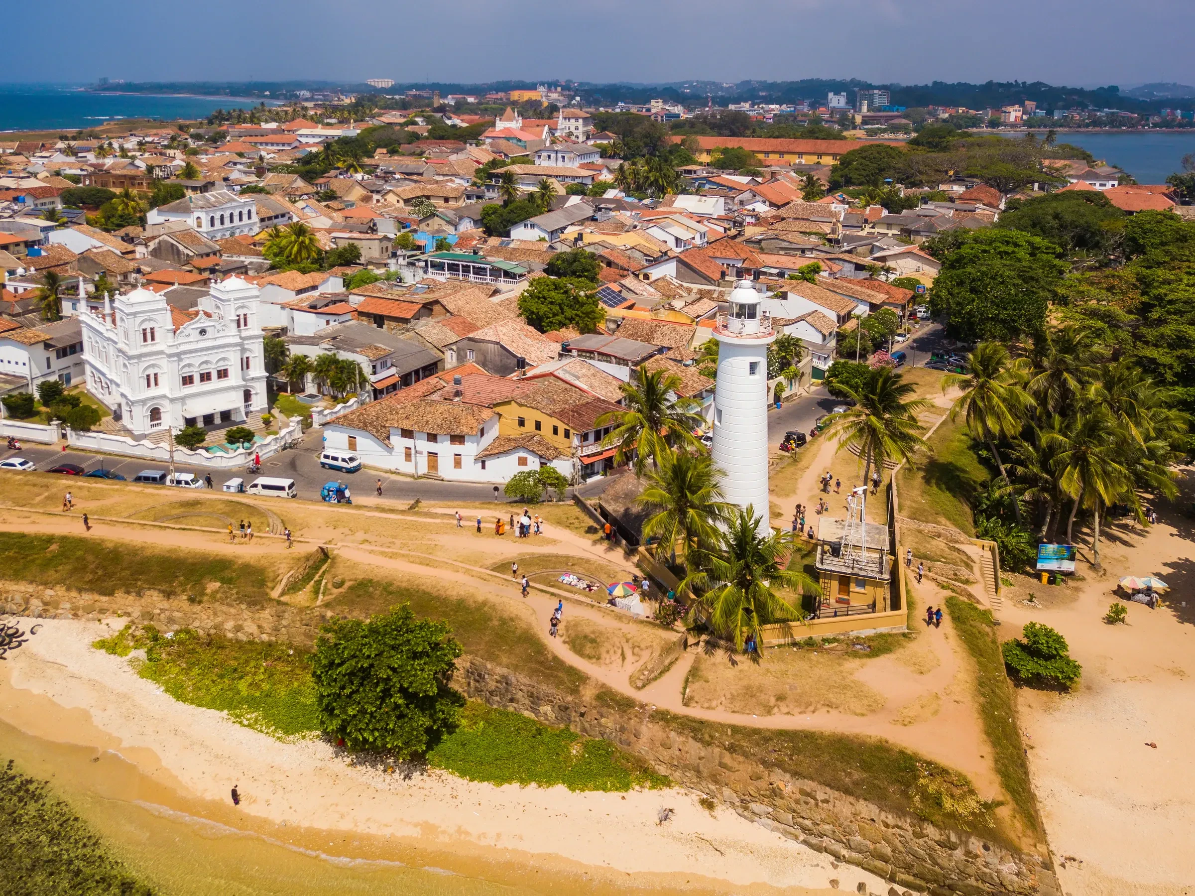 Galle Fort's lighthouse and old town seen from above, with the coast beyond