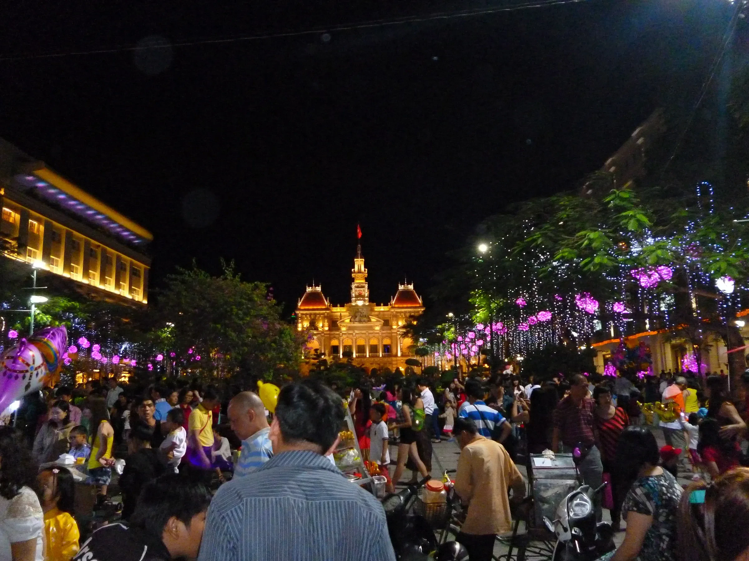 Crowds in front of Ho Chi Minh City Hall at the Nguyen Hue flower street at Tet
