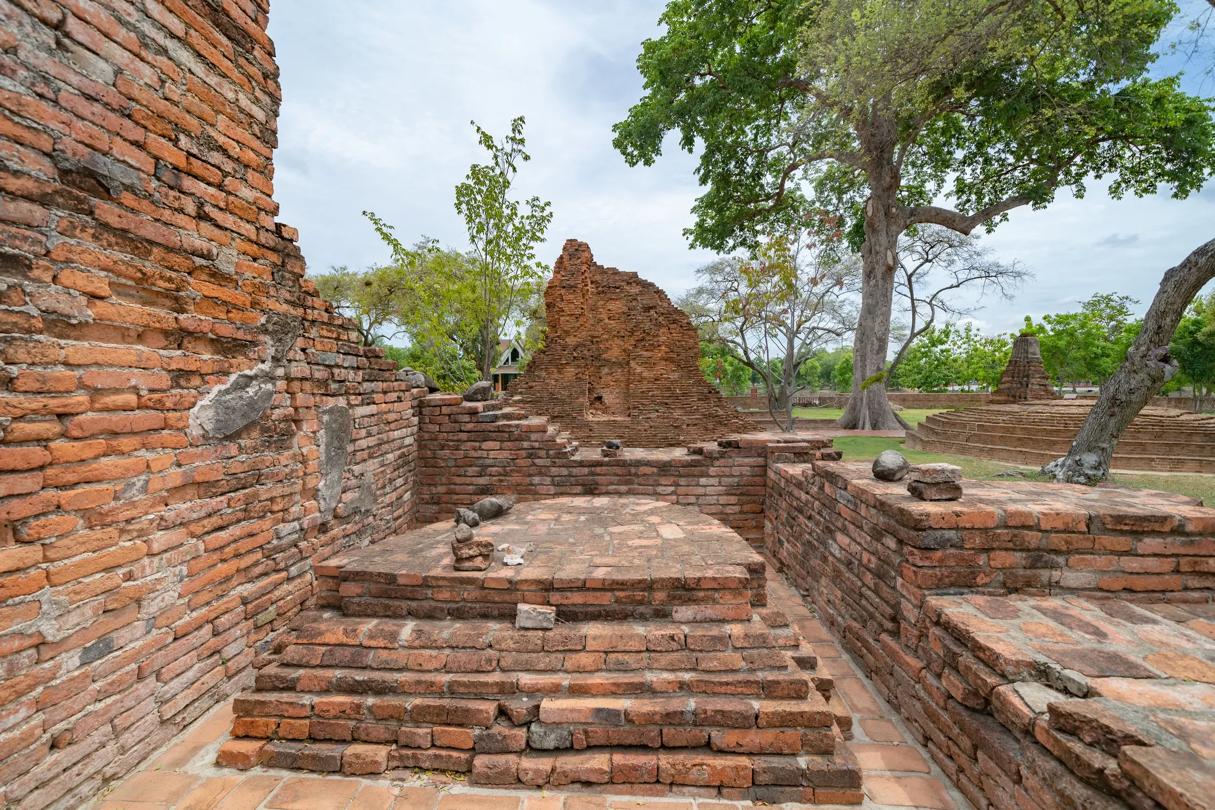 Weathered brick ruins and steps of an old temple in Ayutthaya