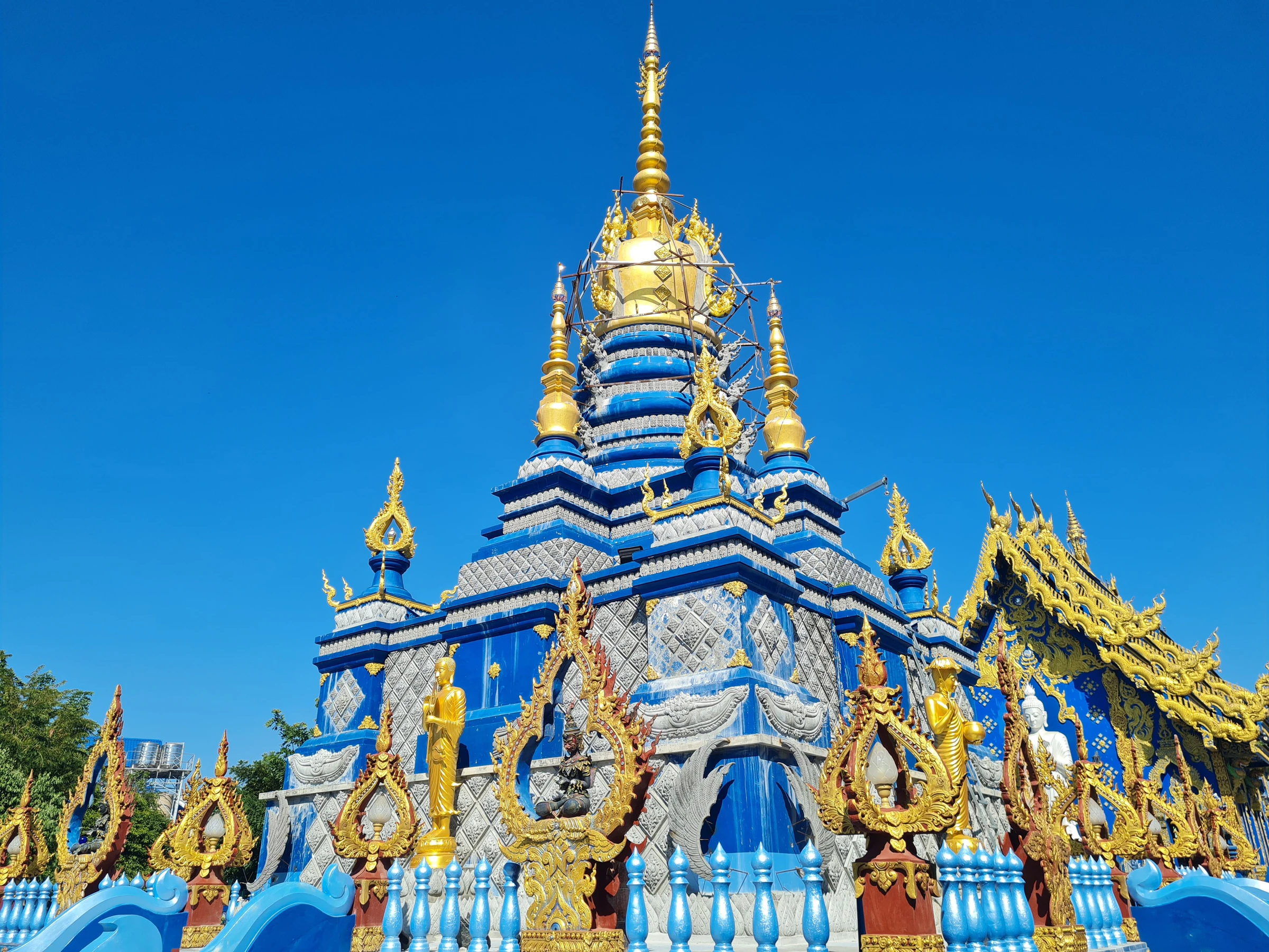 The deep-blue exterior of Wat Rong Suea Ten, the Blue Temple, in Chiang Rai