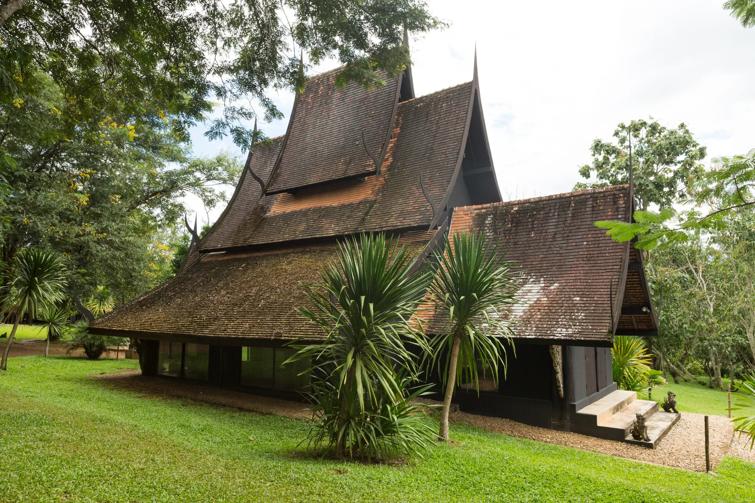 The dark timber buildings of Baan Dam, the Black House, in Chiang Rai