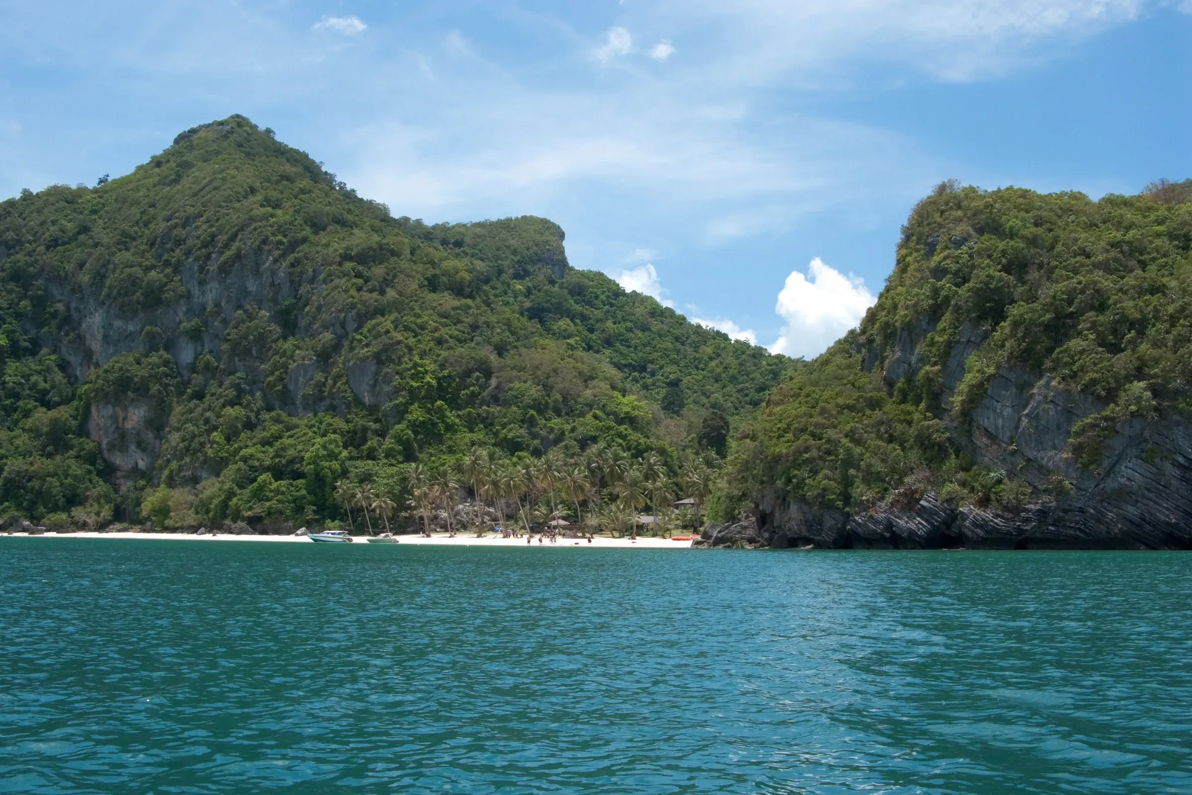 Forested limestone islands around a turquoise bay in Ang Thong Marine Park in the Gulf of Thailand