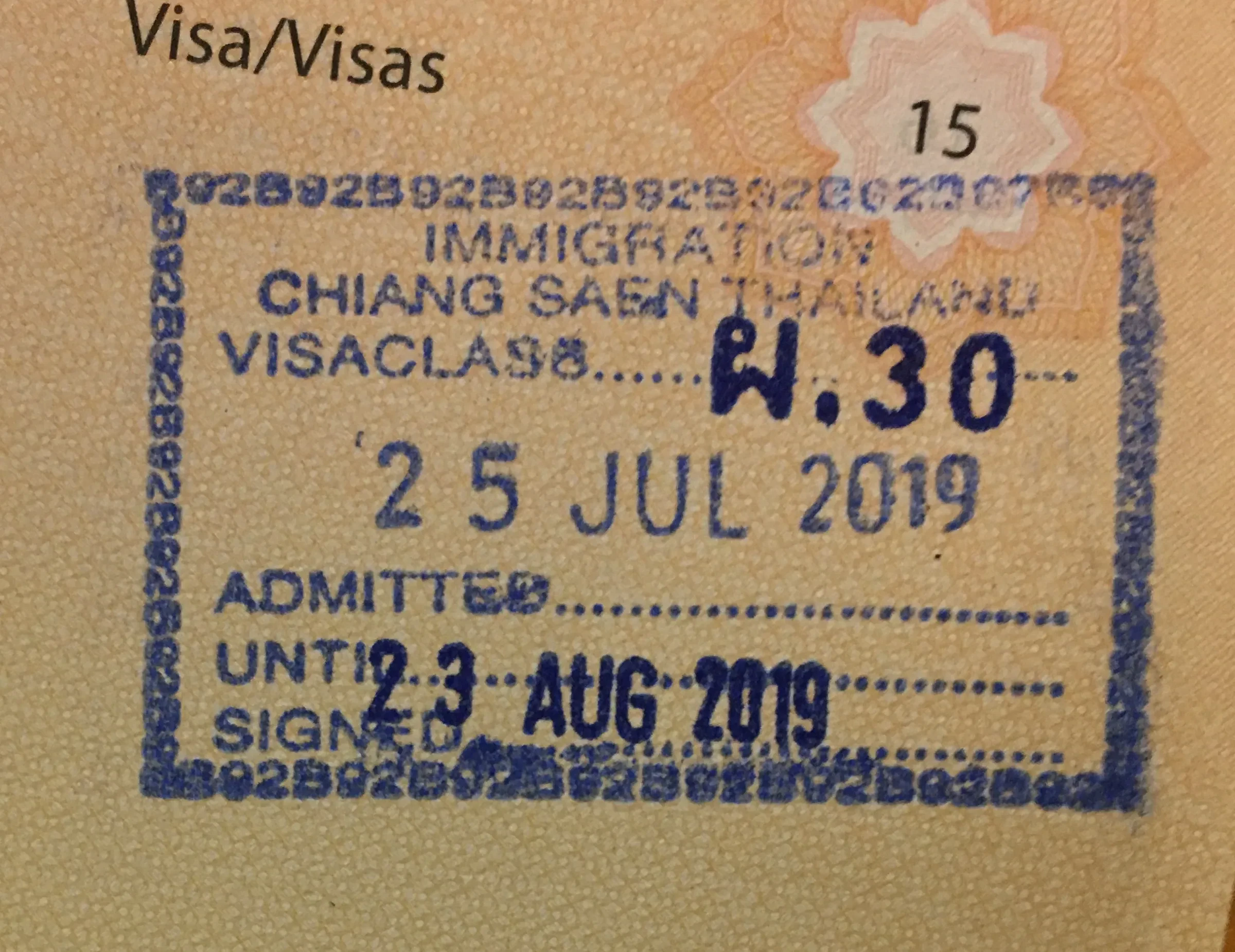 A Thai immigration entry stamp in a passport with the admitted until date