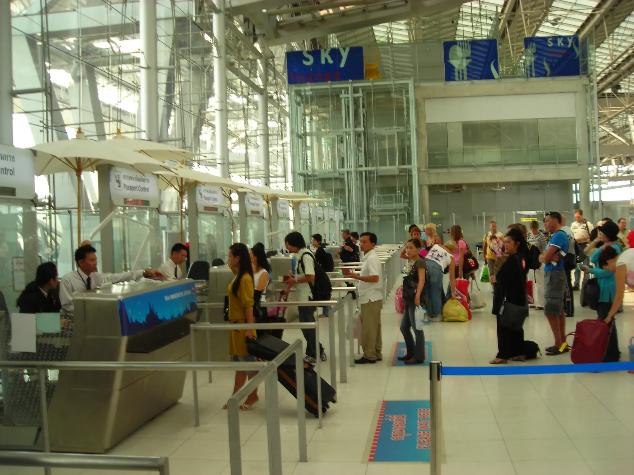 Travellers lined up at passport control counters at Suvarnabhumi Airport