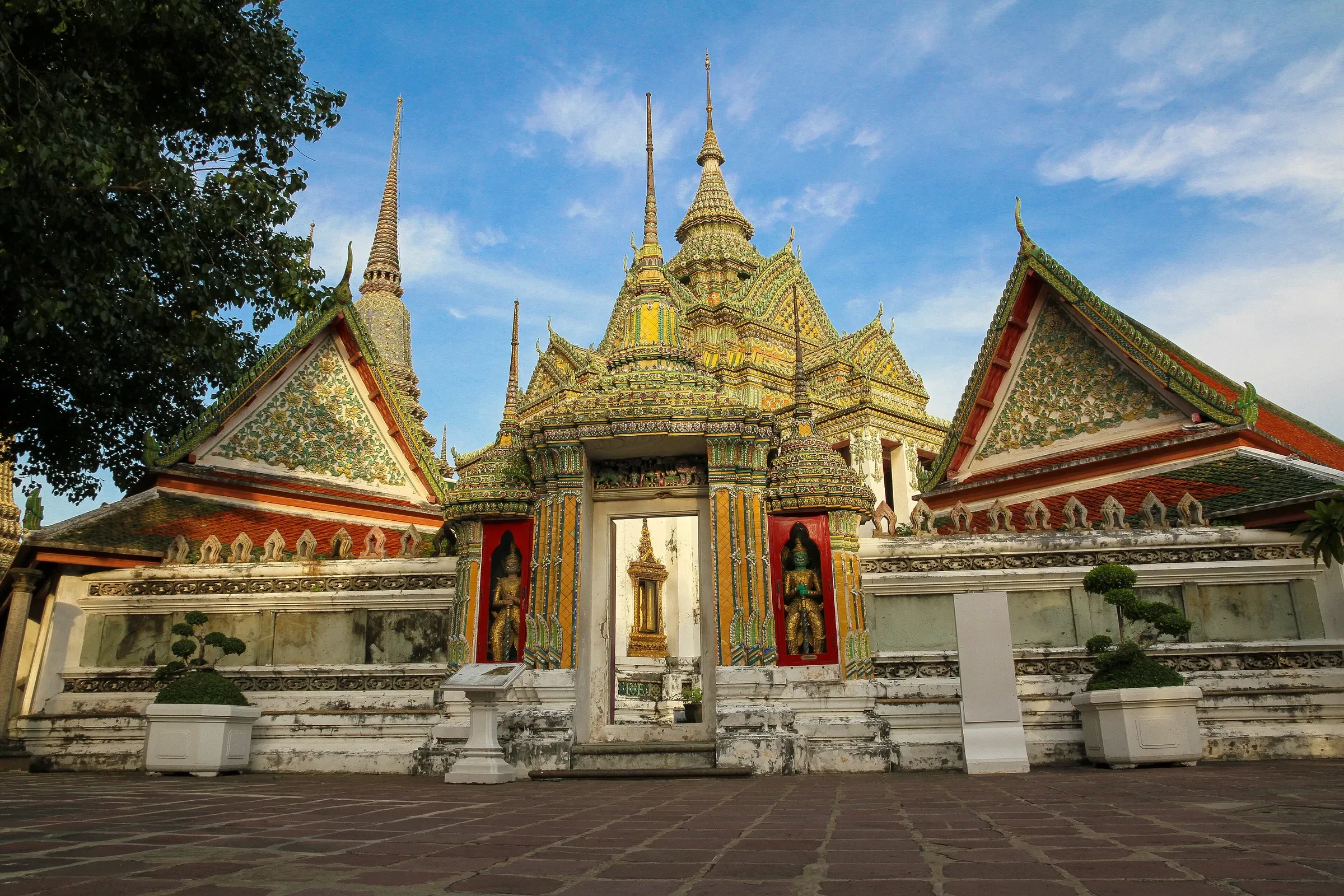 A gateway and chedis at Wat Pho temple in Bangkok