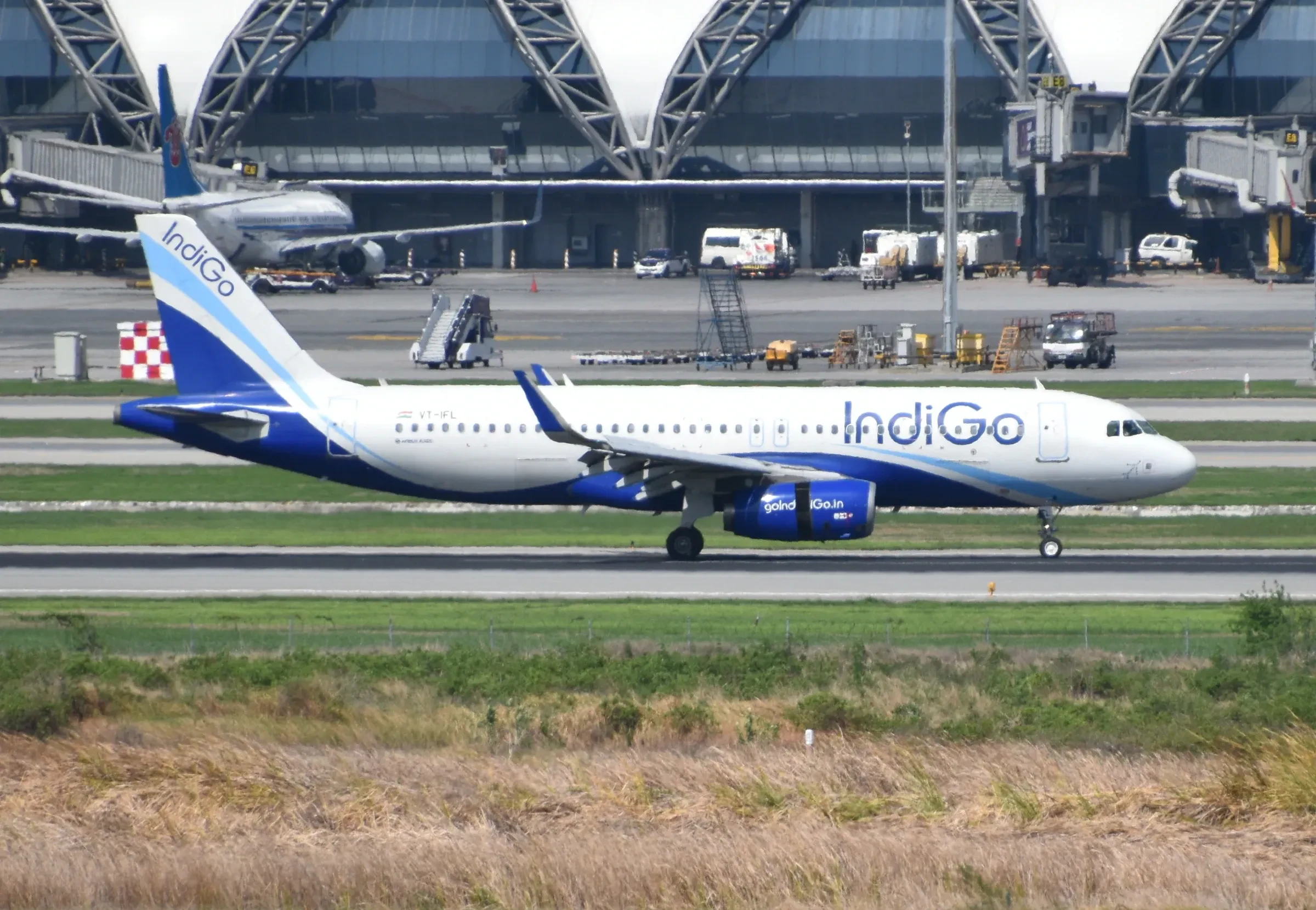 An IndiGo Airbus A320 taxiing at Suvarnabhumi Airport in Bangkok