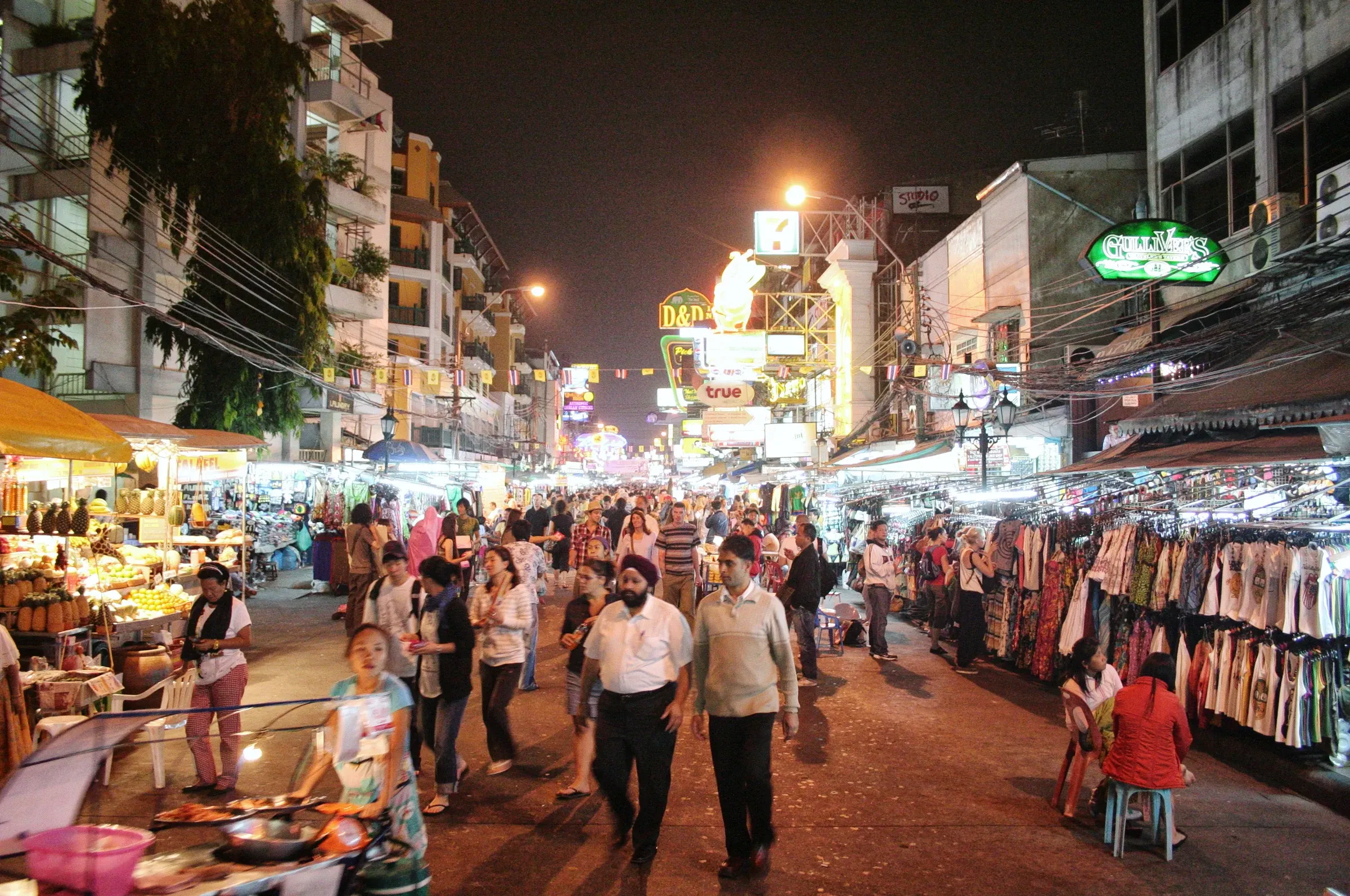 Crowds browsing the market stalls on Khao San Road in Bangkok at night