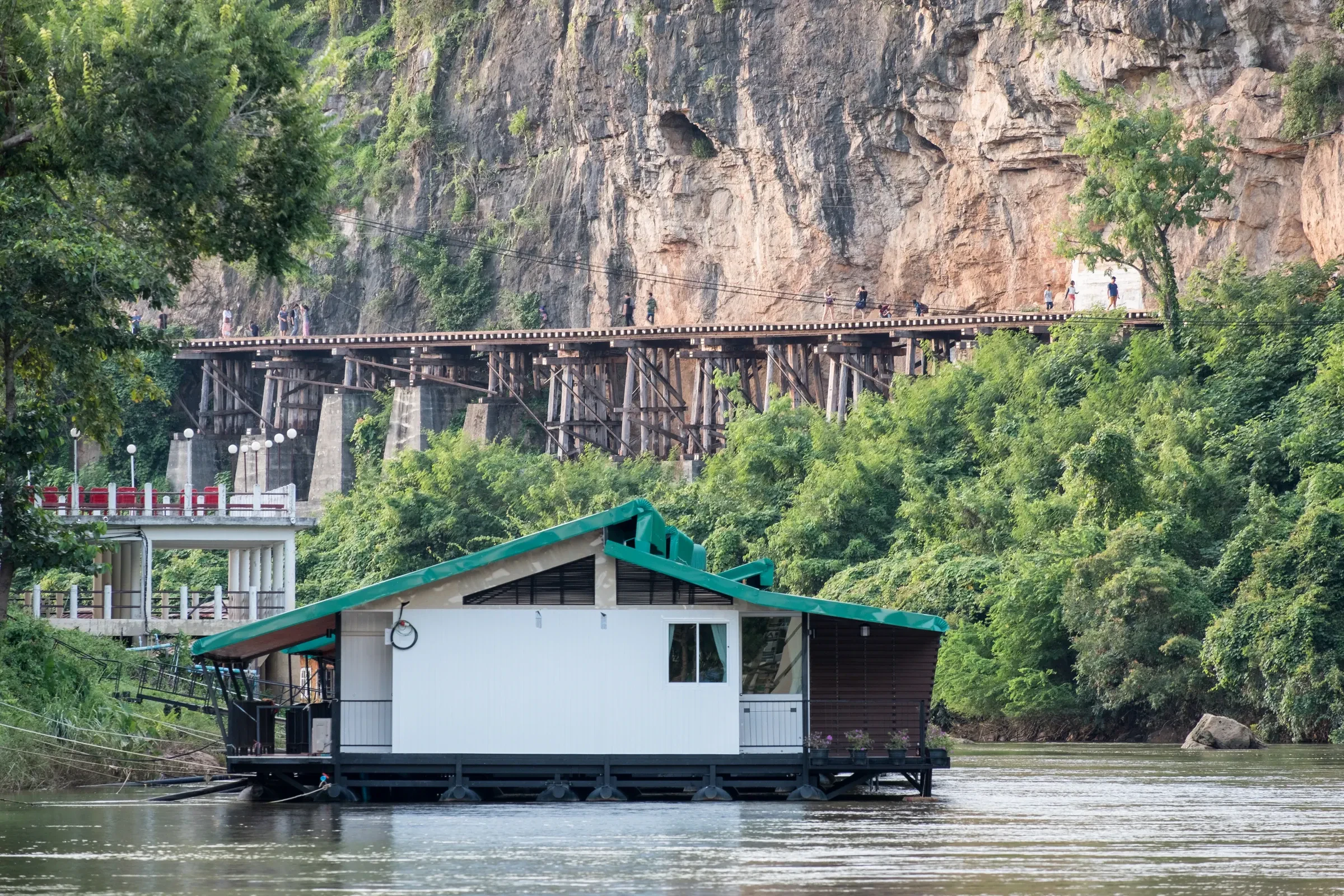 A floating raft house guesthouse moored on the River Kwai
