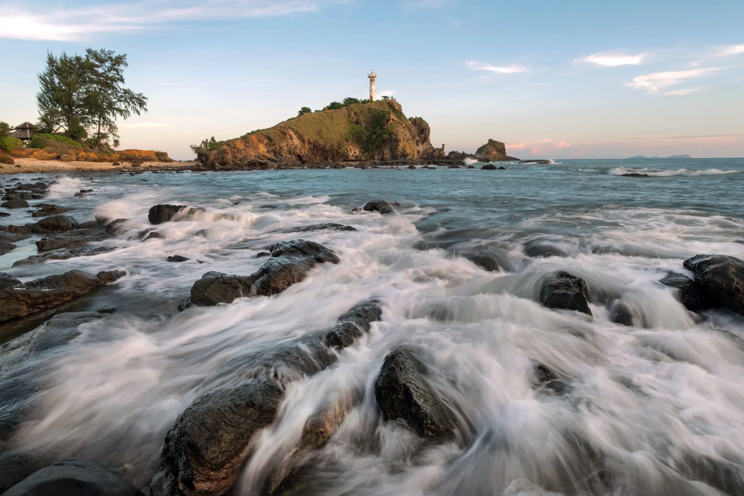 The lighthouse on the Laem Tanod headland in Mu Ko Lanta National Park, above breaking surf