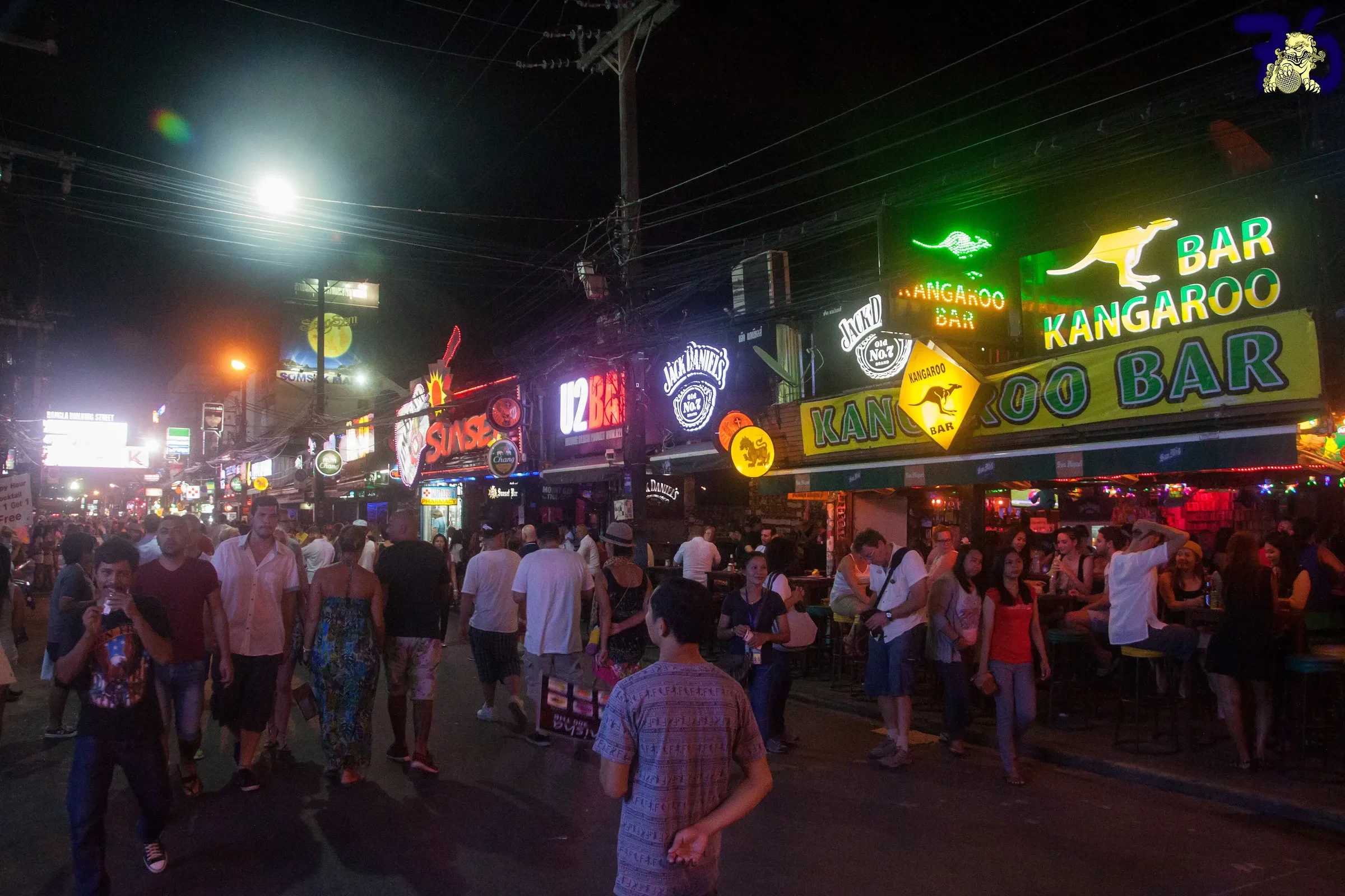 Bangla Road at night in Patong, Phuket, lit up with bar and club signs