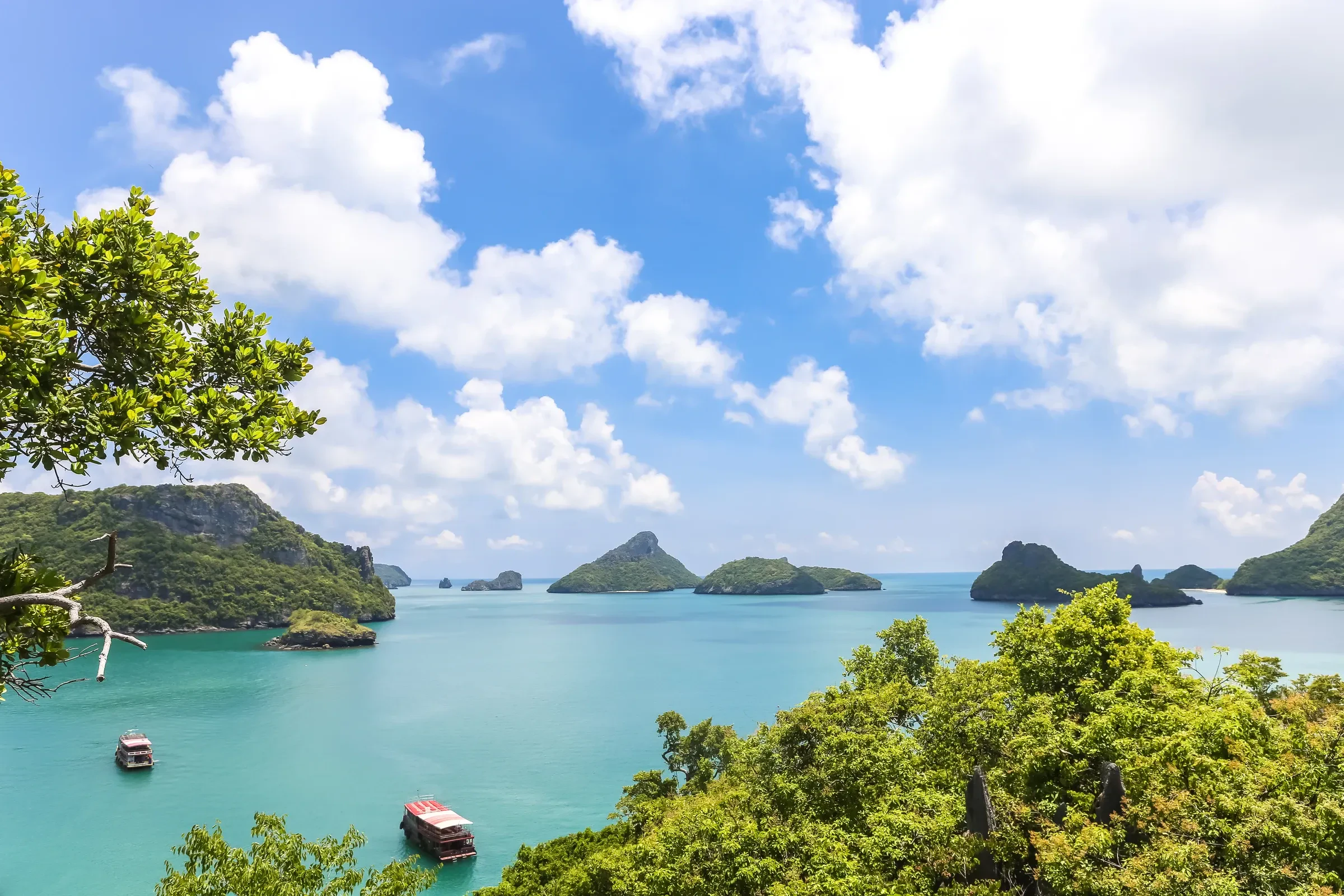 Green limestone islands and turquoise water seen from a viewpoint in Ang Thong Marine Park, near Koh Samui