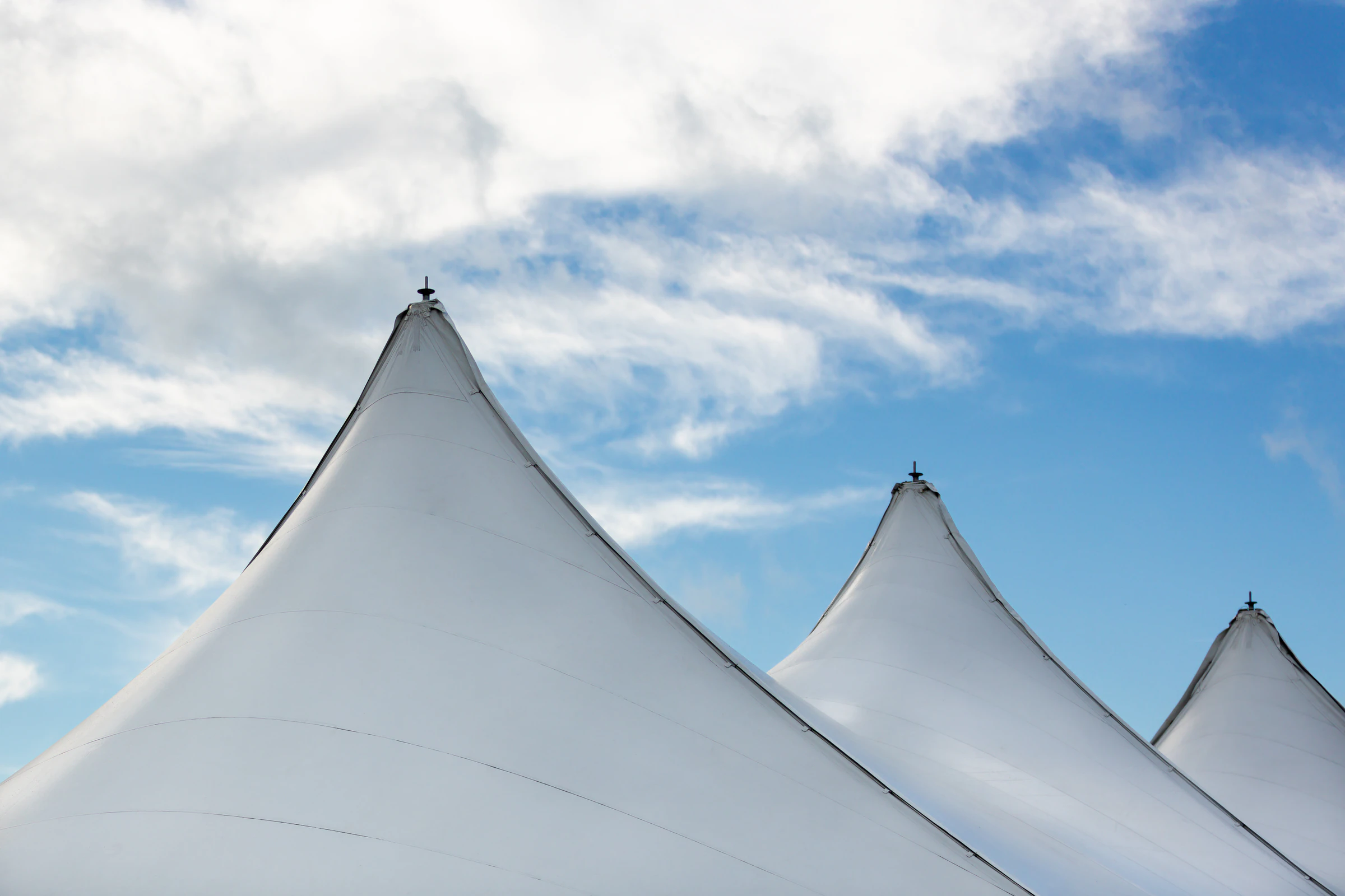 Tents at a glamping site set up for an outdoor festival