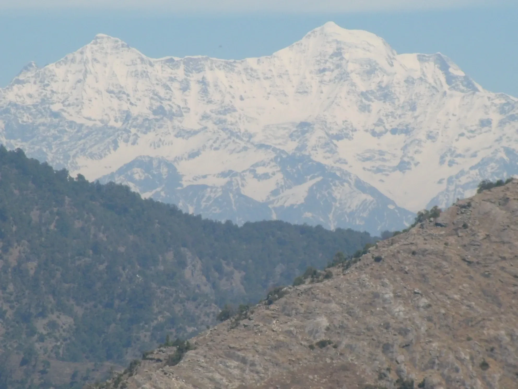 Snow peaks seen across the hills from Camel's Back Road in Mussoorie