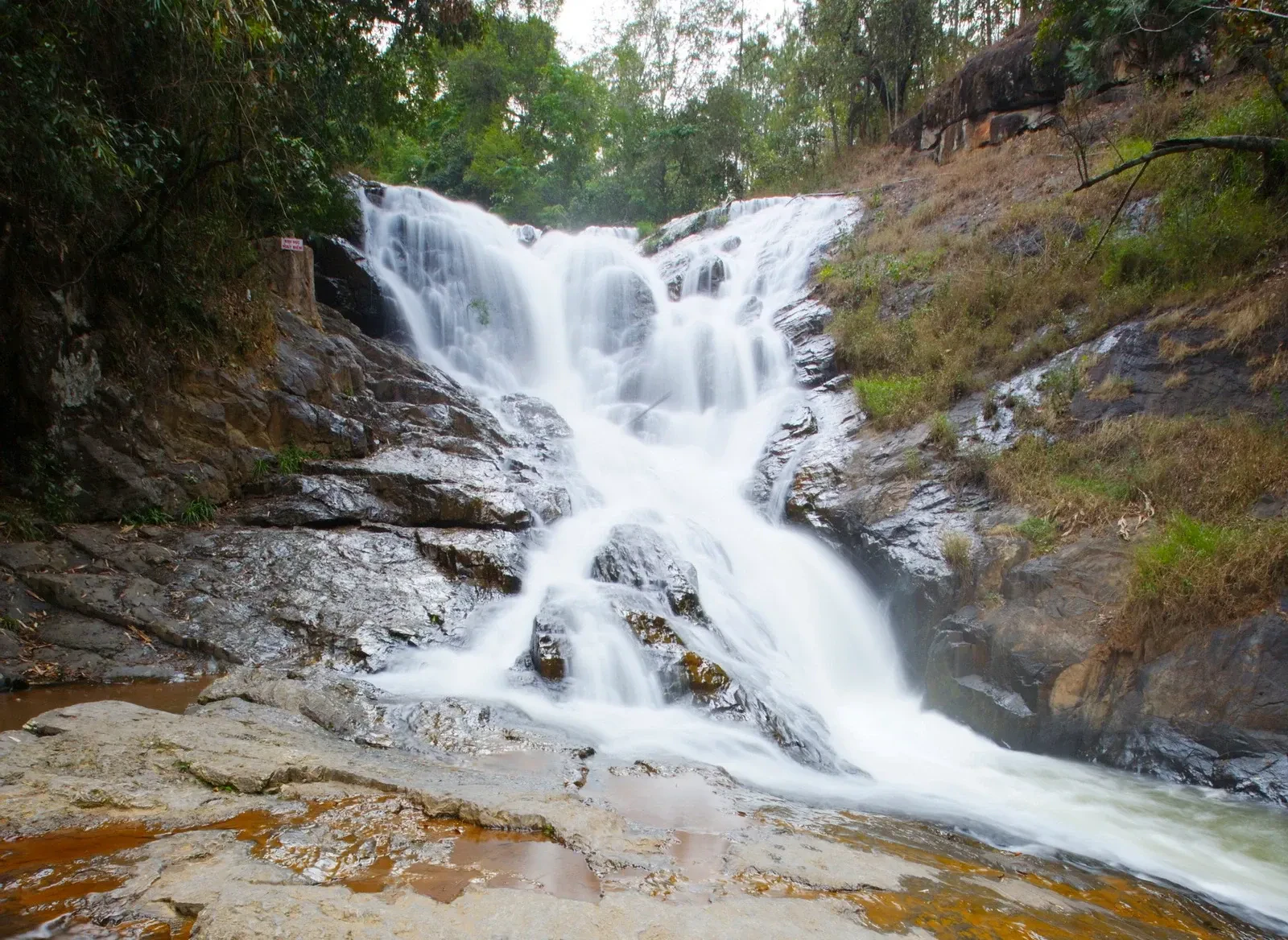 Datanla Falls tumbling over rocks through forest near Da Lat