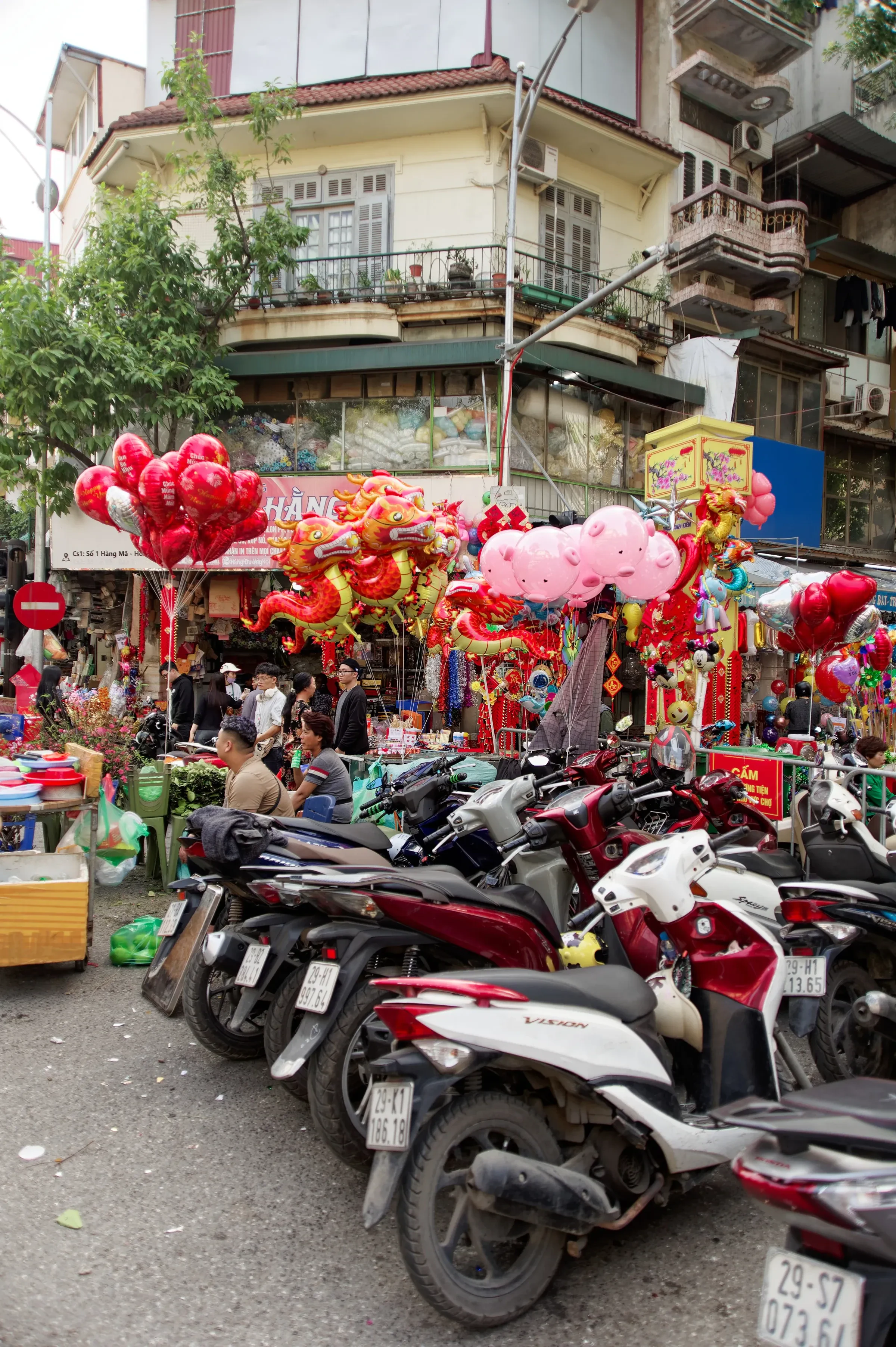 Scooters parked on a busy street in Hanoi's Old Quarter