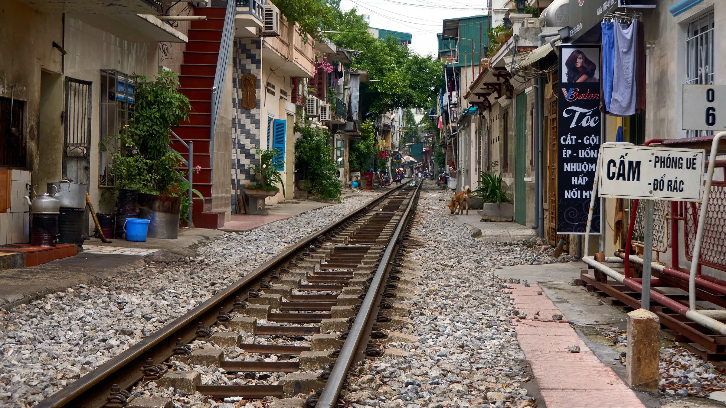 A narrow lane of houses beside the railway line on Hanoi's Train Street
