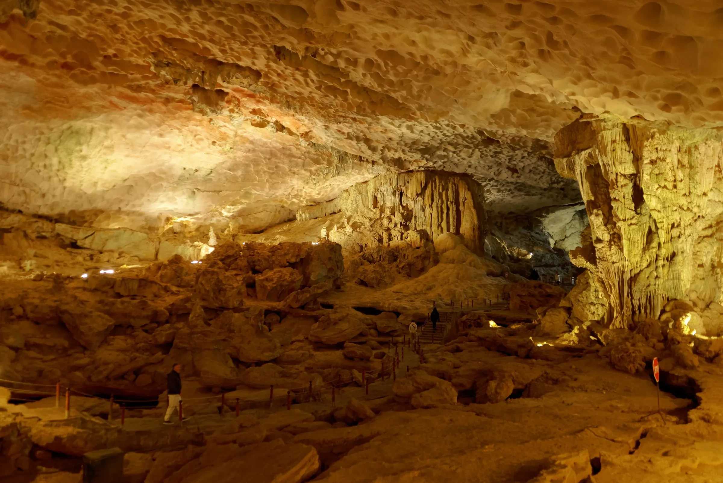 Lit stalactite chambers inside Sung Sot Cave in Ha Long Bay