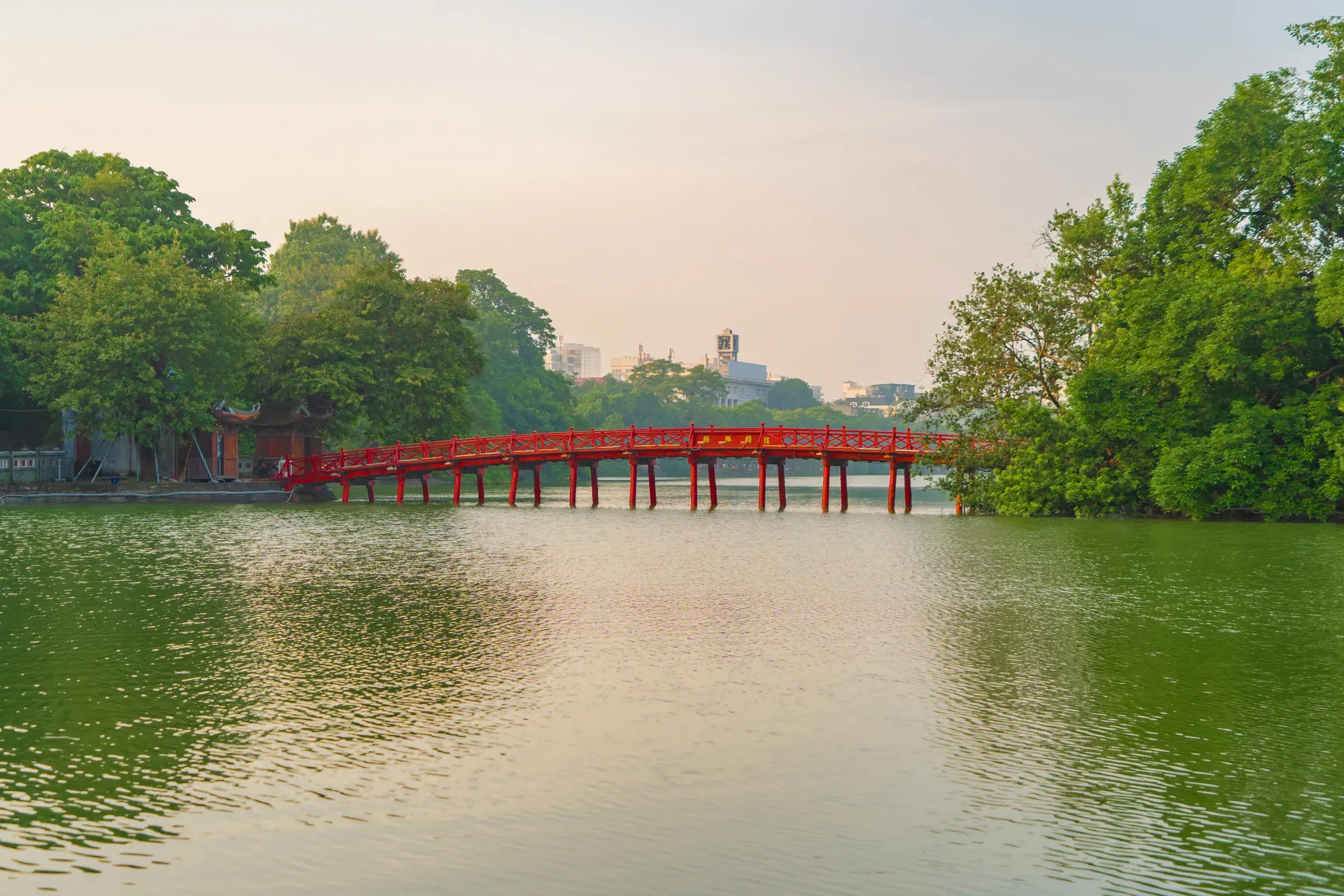 A red footbridge over Hoan Kiem Lake in central Hanoi