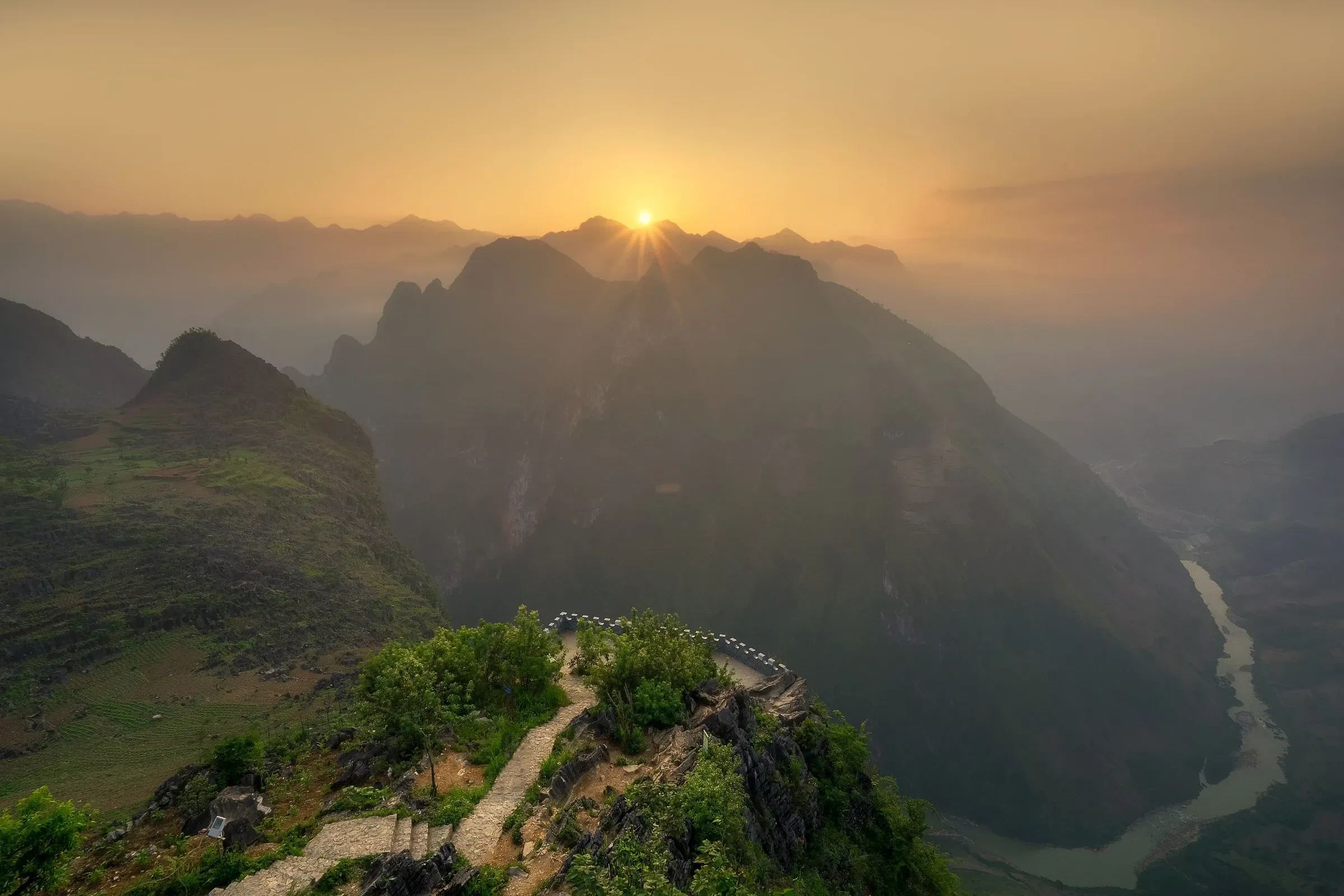 Sunrise over the Nho Que River gorge from Ma Pi Leng Pass on the Ha Giang Loop