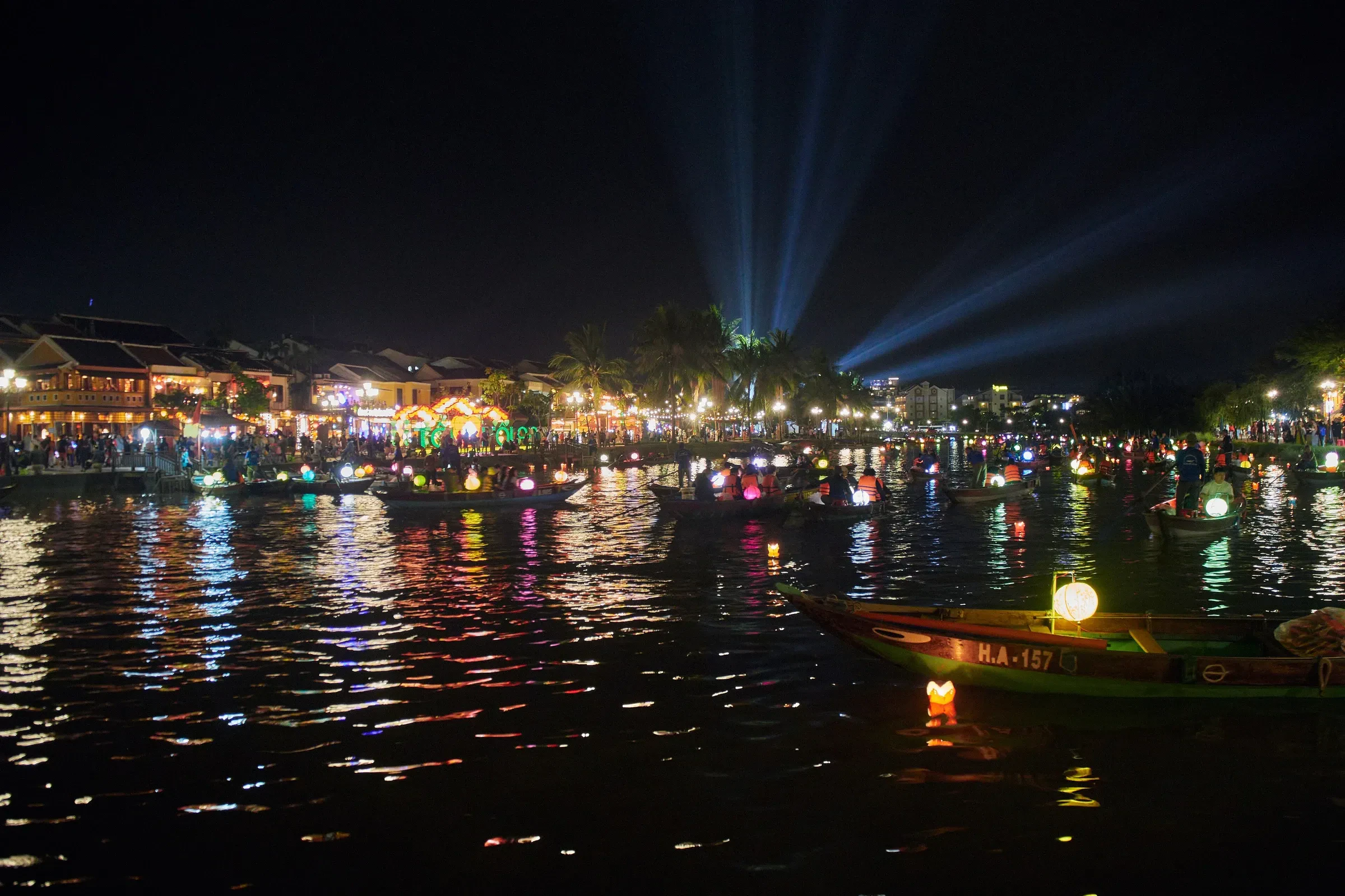 Lantern-decorated boats on the Thu Bon River at night in Hoi An