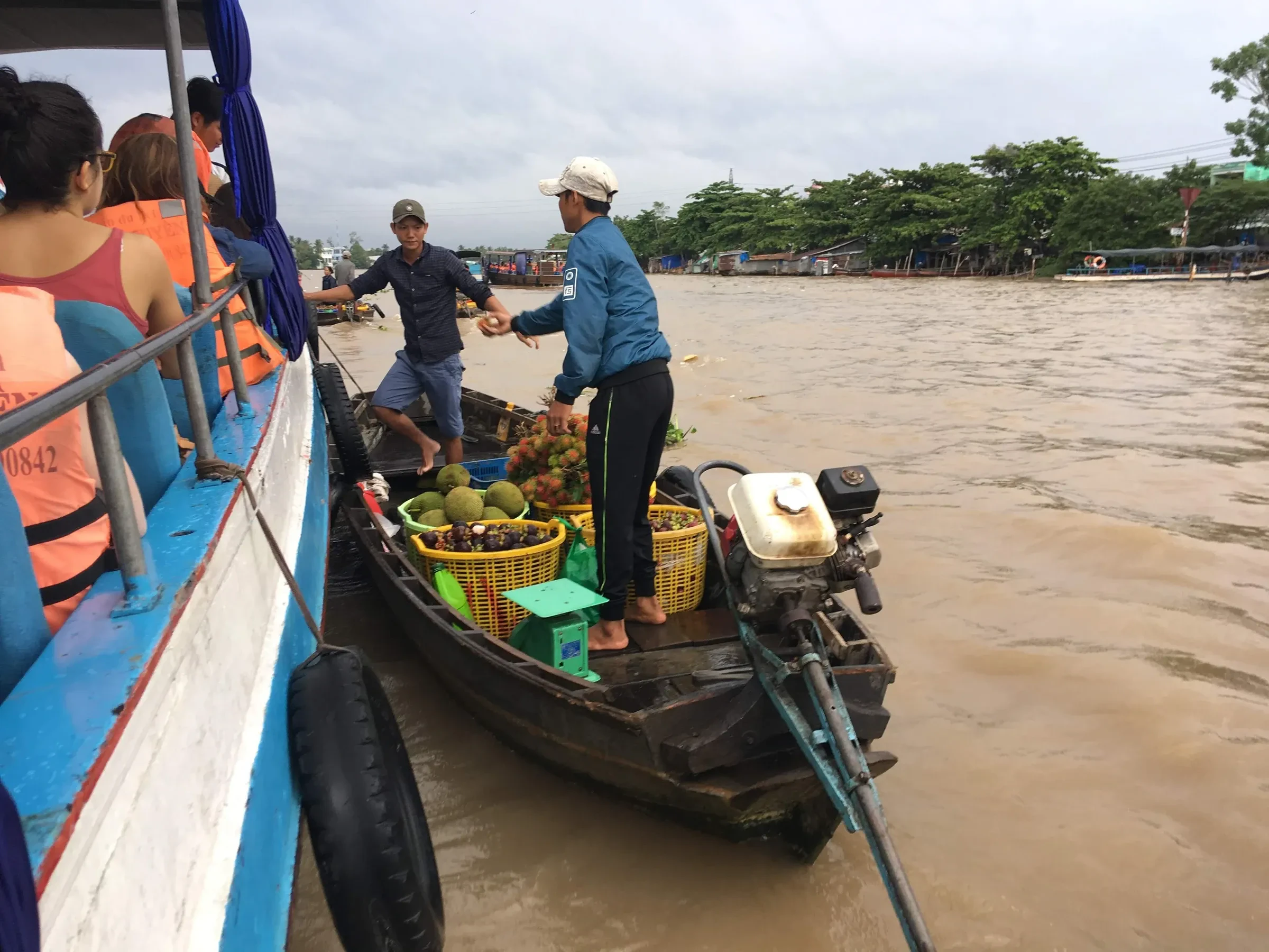 A boat selling fruit to tourists at the Cai Rang floating market near Can Tho