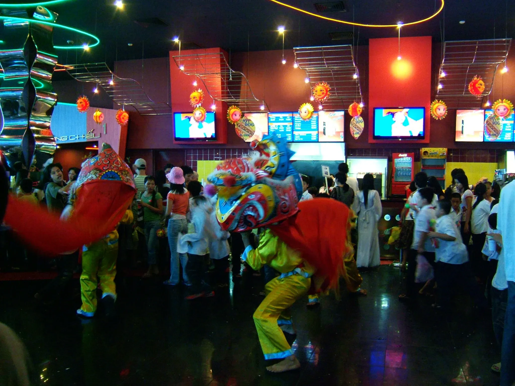Lion dancers performing in front of a crowd in Vietnam