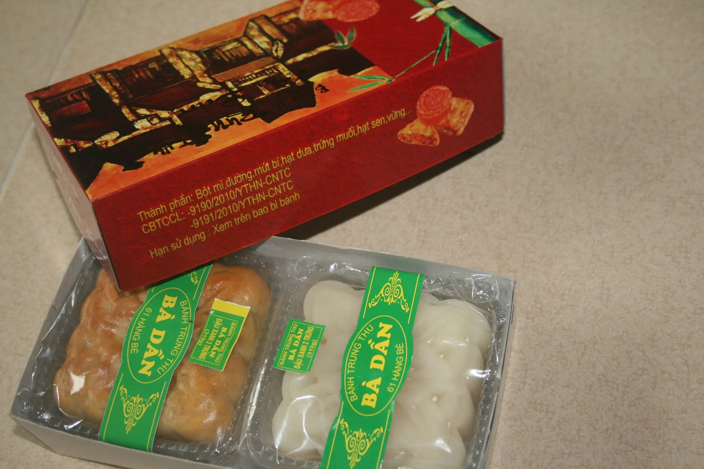A box of banh nuong and banh deo mooncakes from a traditional Hanoi bakery