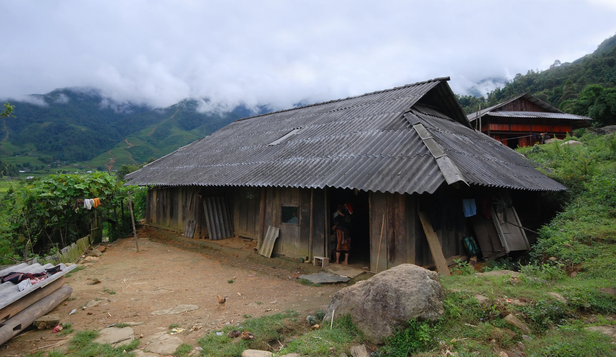 A wooden homestay in Ta Van village among the Muong Hoa valley's rice terraces