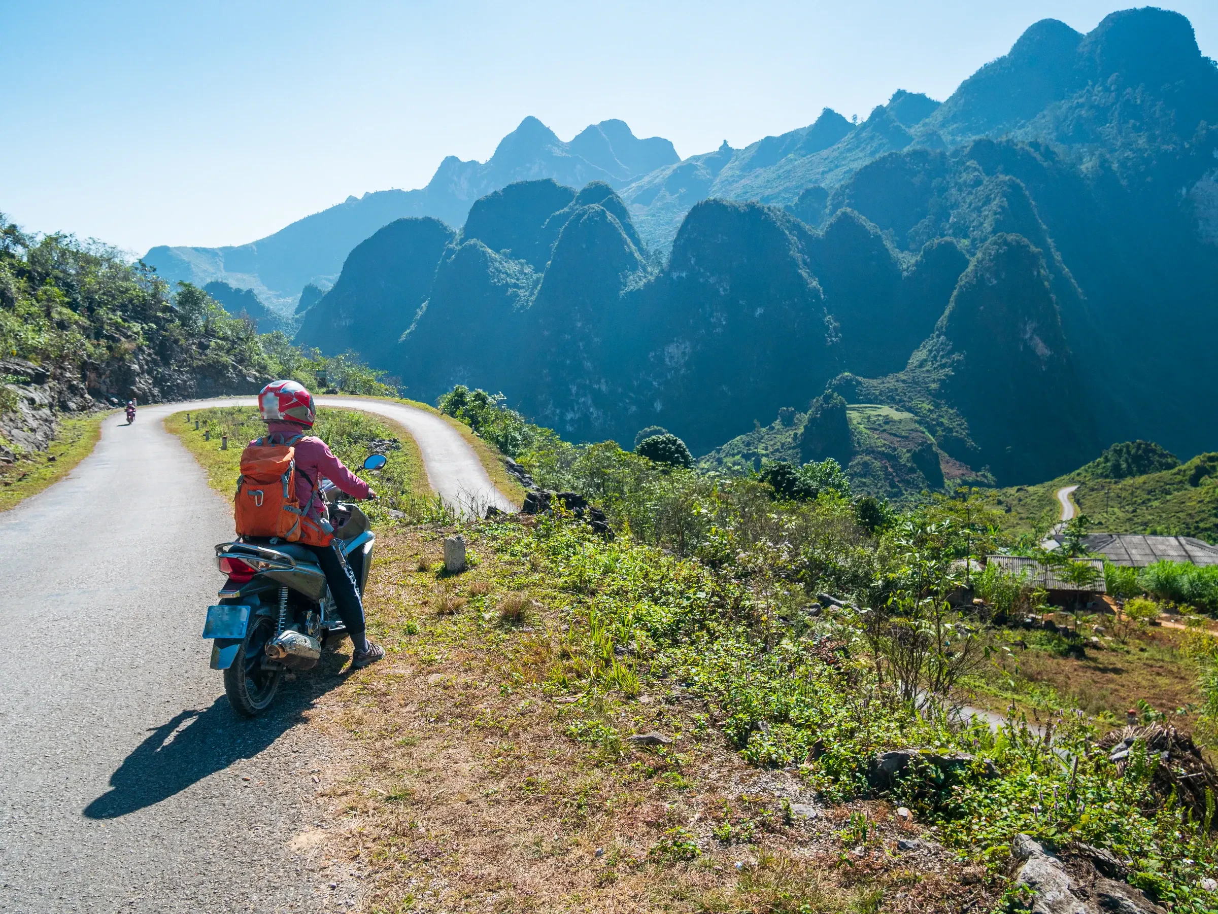 A motorbike rider on a mountain road on the Ha Giang Loop in northern Vietnam