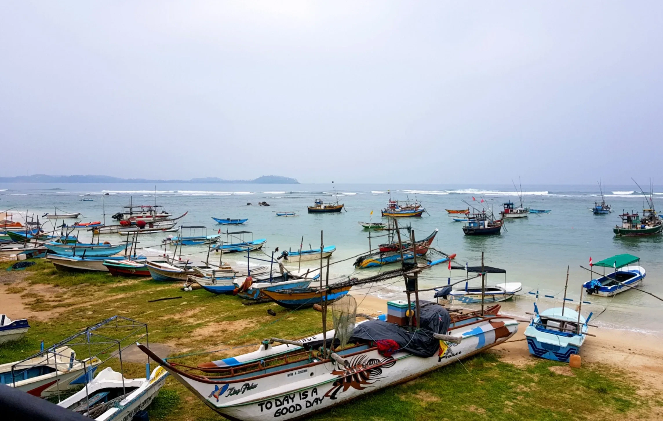 Fishing boats pulled up on the shore of Weligama Bay