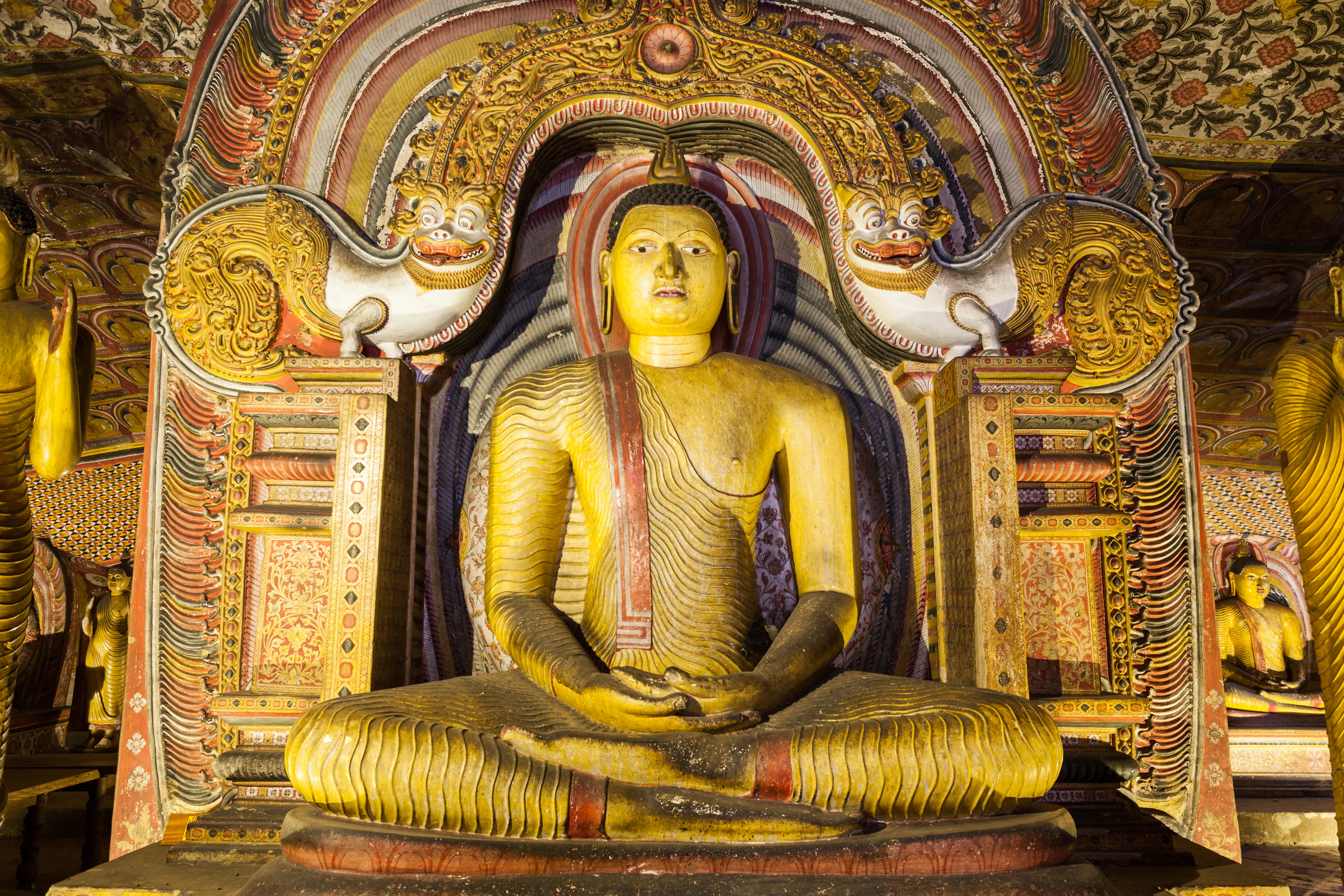 Ancient Buddha statues inside Dambulla's painted cave temple