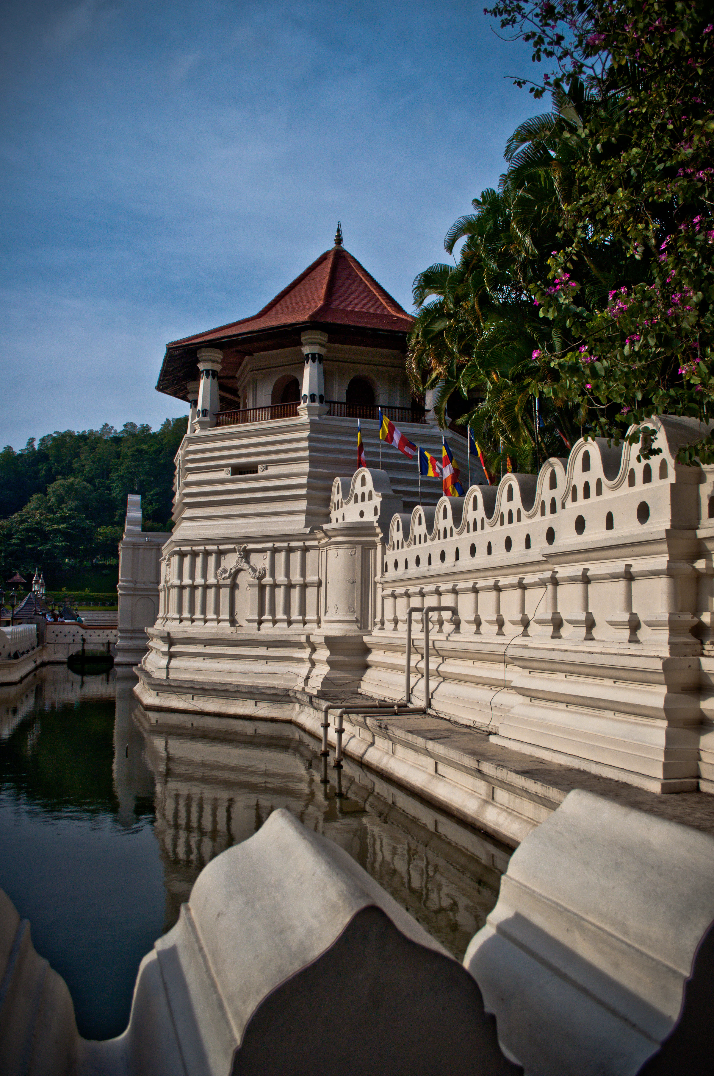 The white moat wall and octagonal tower of the Temple of the Tooth in Kandy