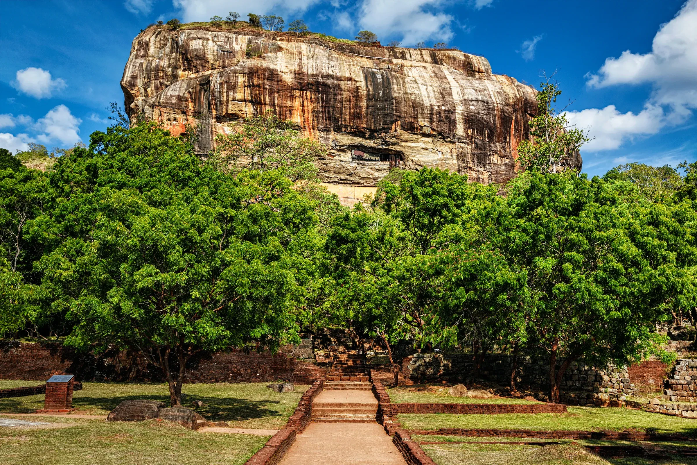 Sigiriya Rock rising above the green royal gardens