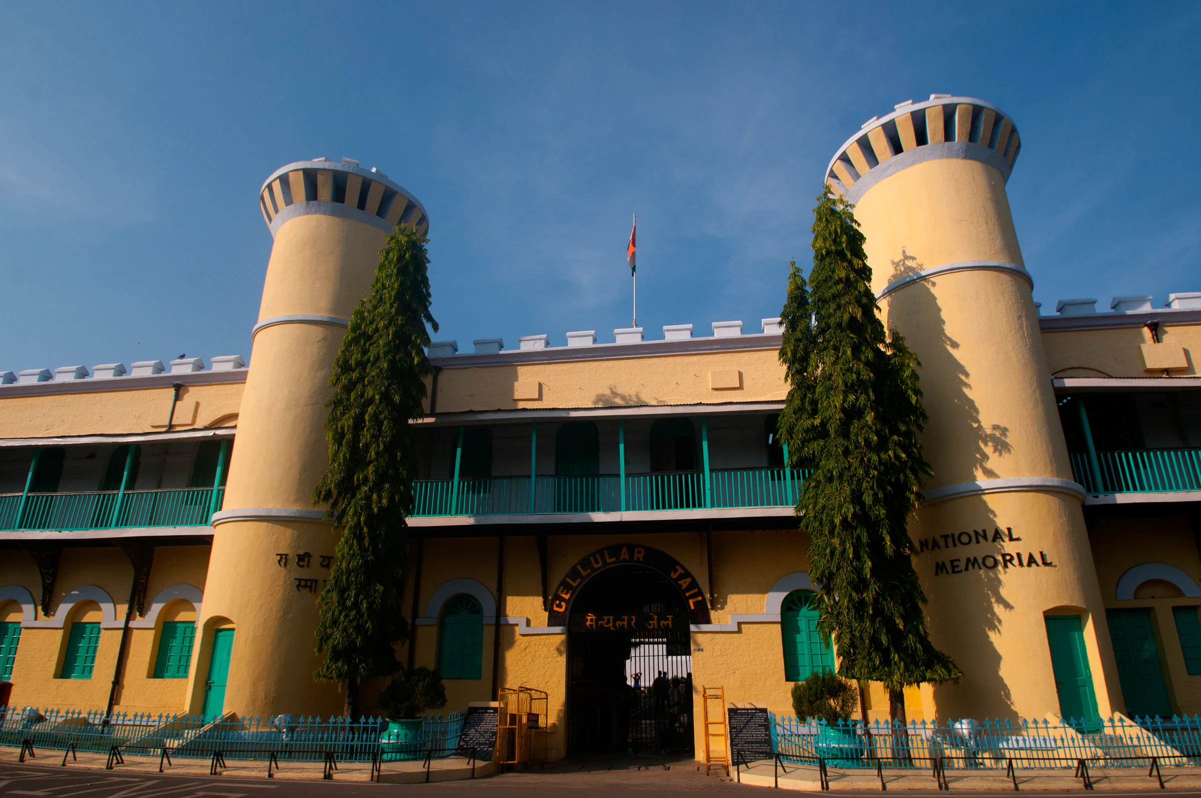 The yellow gatehouse towers of the Cellular Jail National Memorial in Port Blair