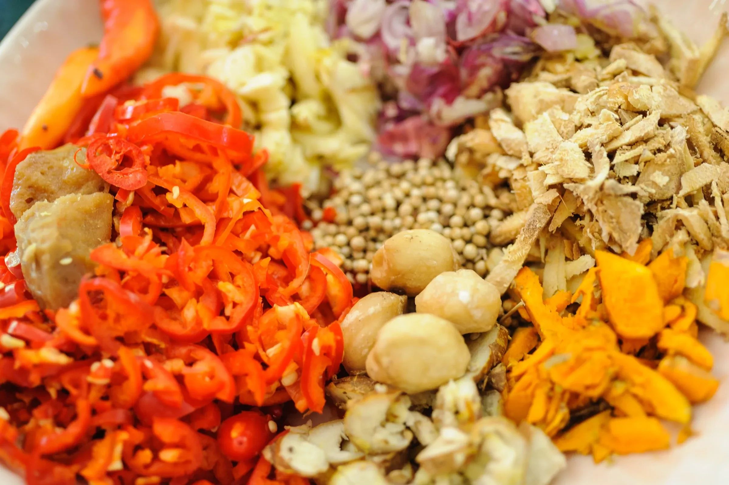A tray of fresh chillies, shallots and spices at a market in Ubud